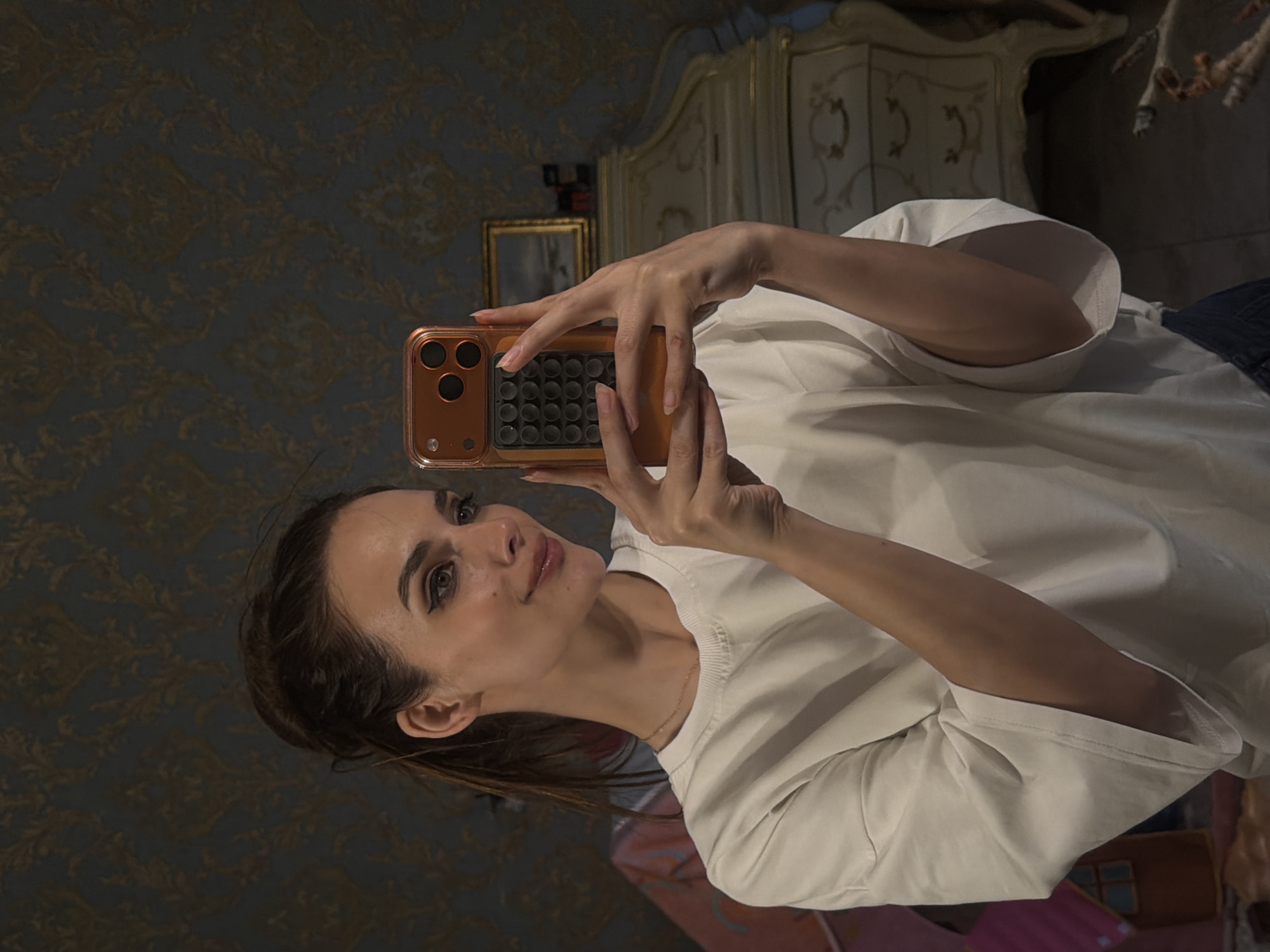 Selfies in an ornate Ufa interior with gilded mirror