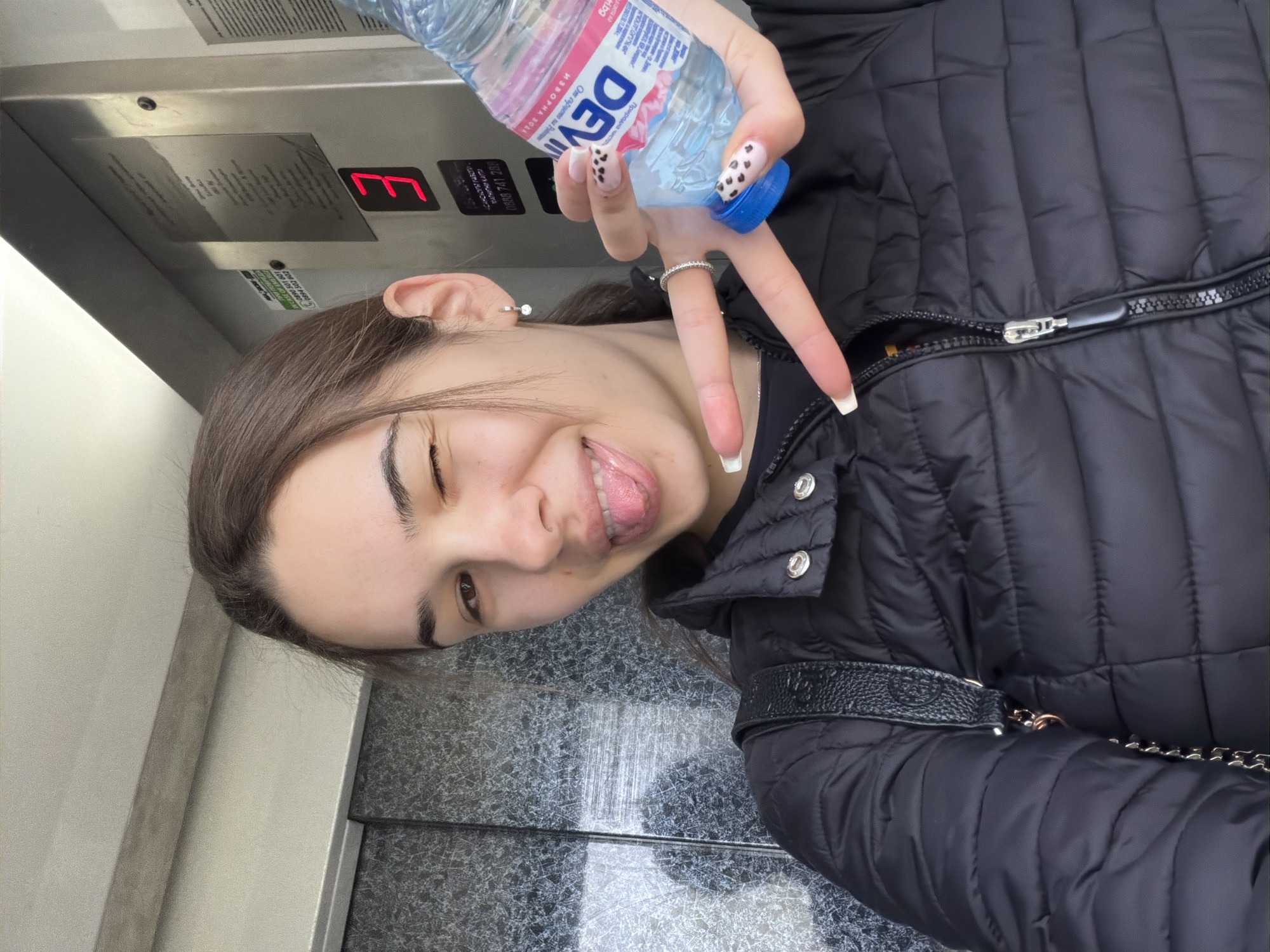 Woman photographed in marble elevator in Sofia