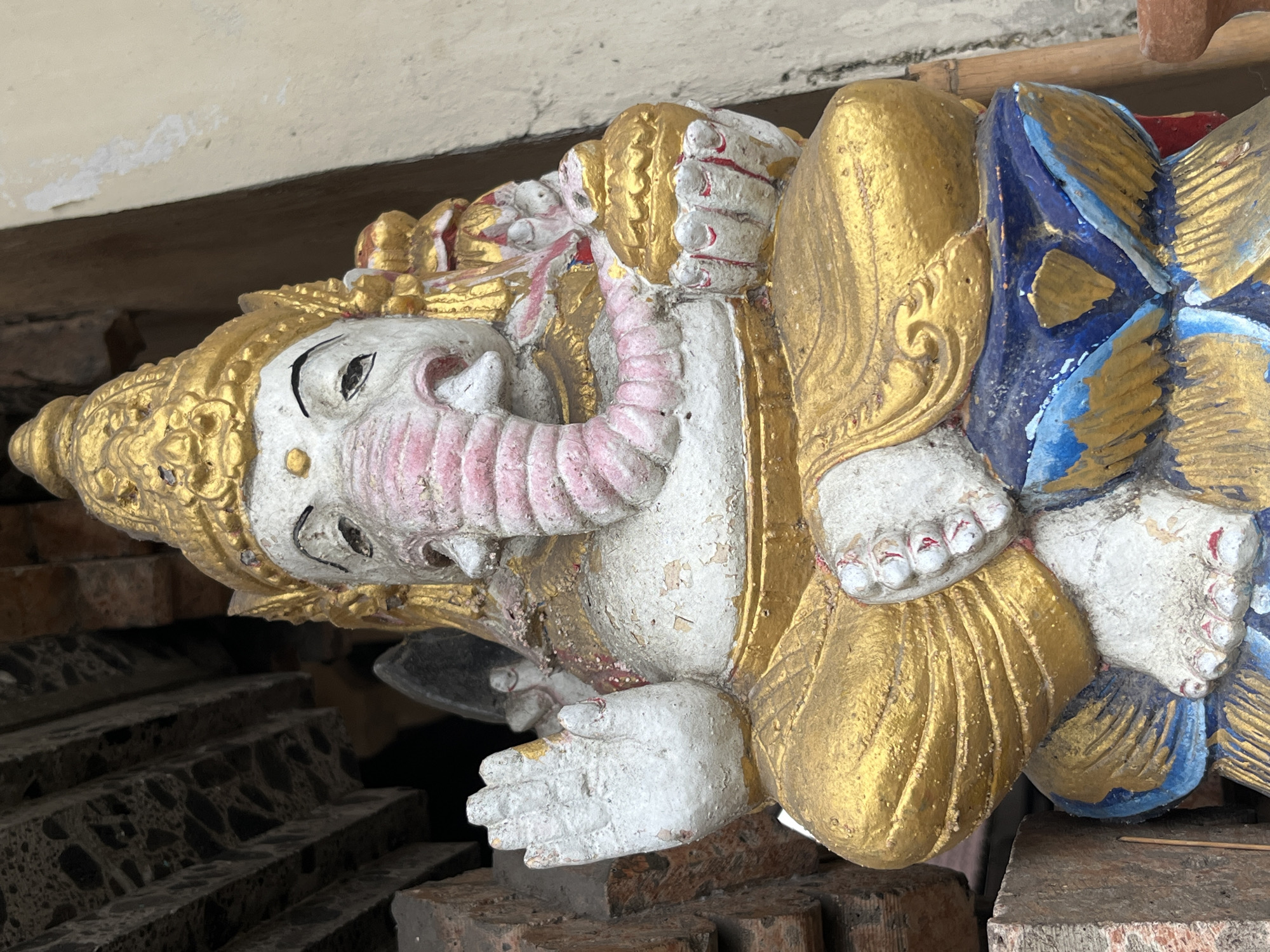 Weathered religious statues documented in Kuta Selatan, Indonesia