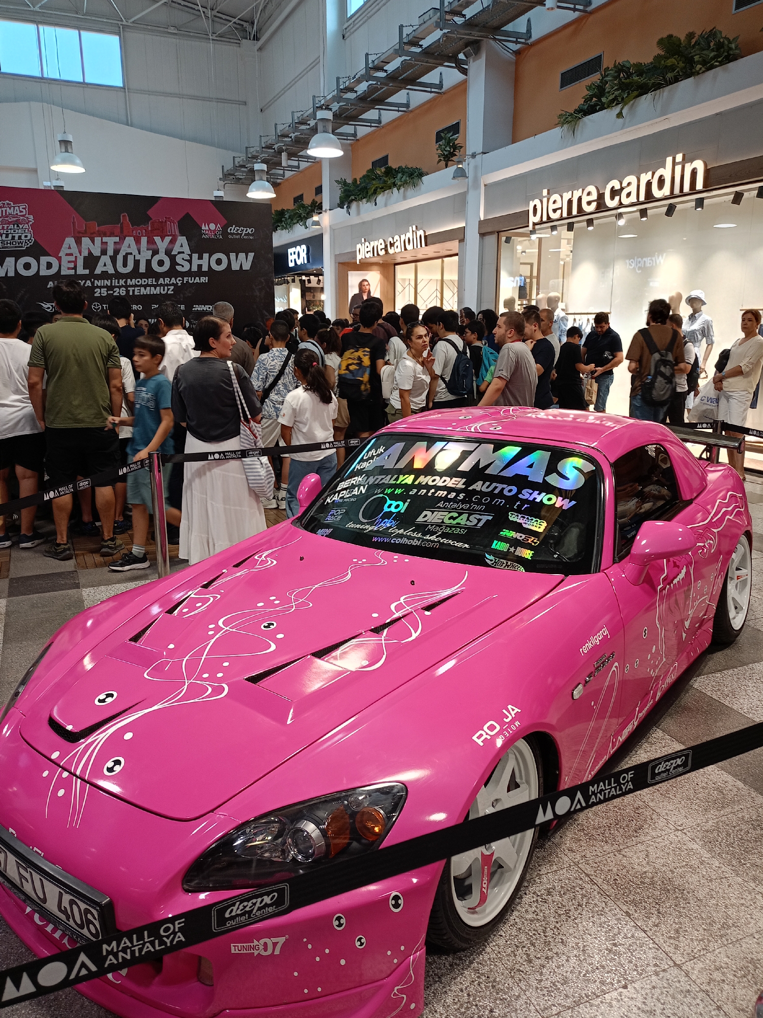 Pink sports car on display at Antalya mall car show