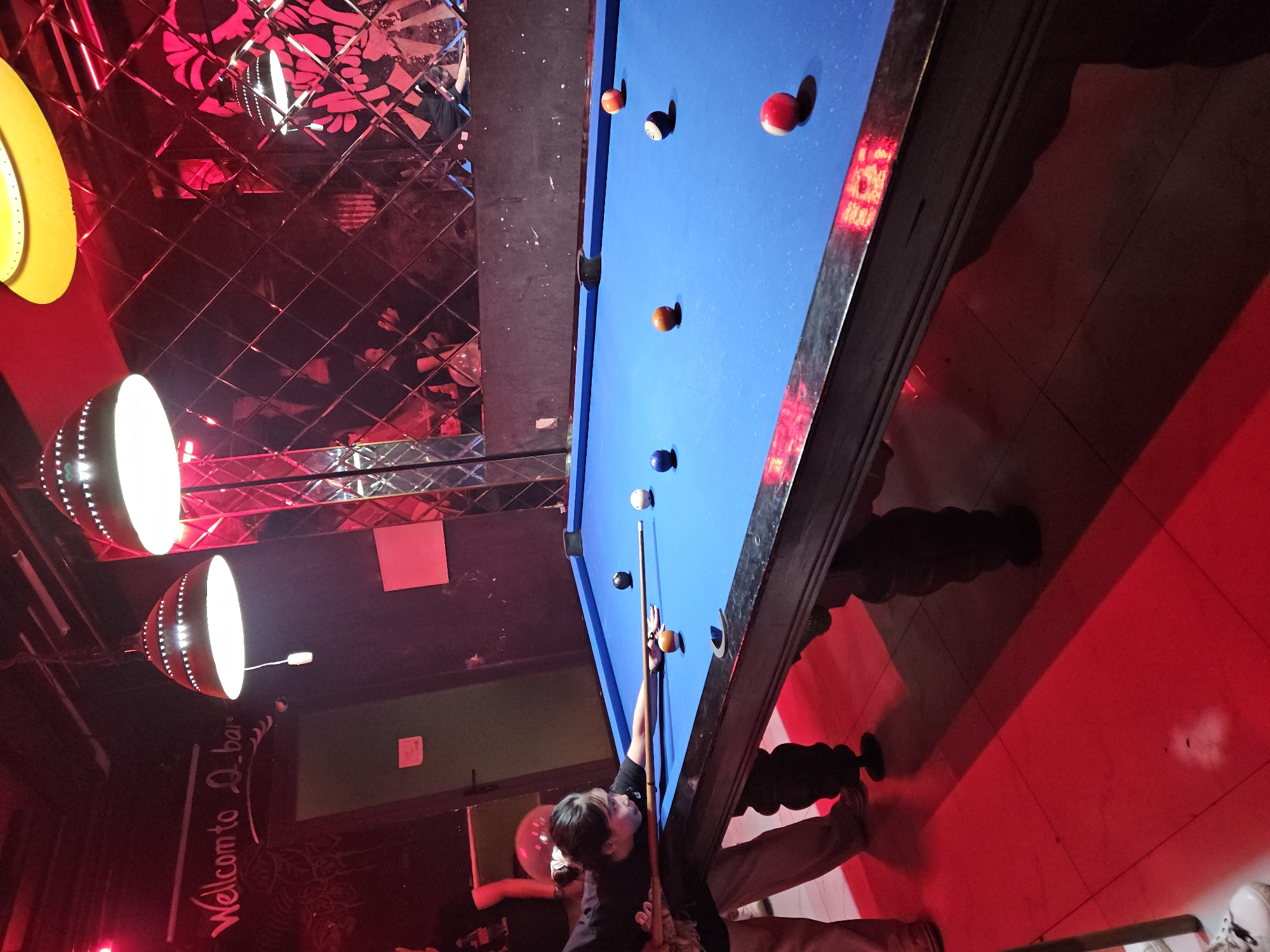 Pool game captured at red-lit Nha Trang establishment