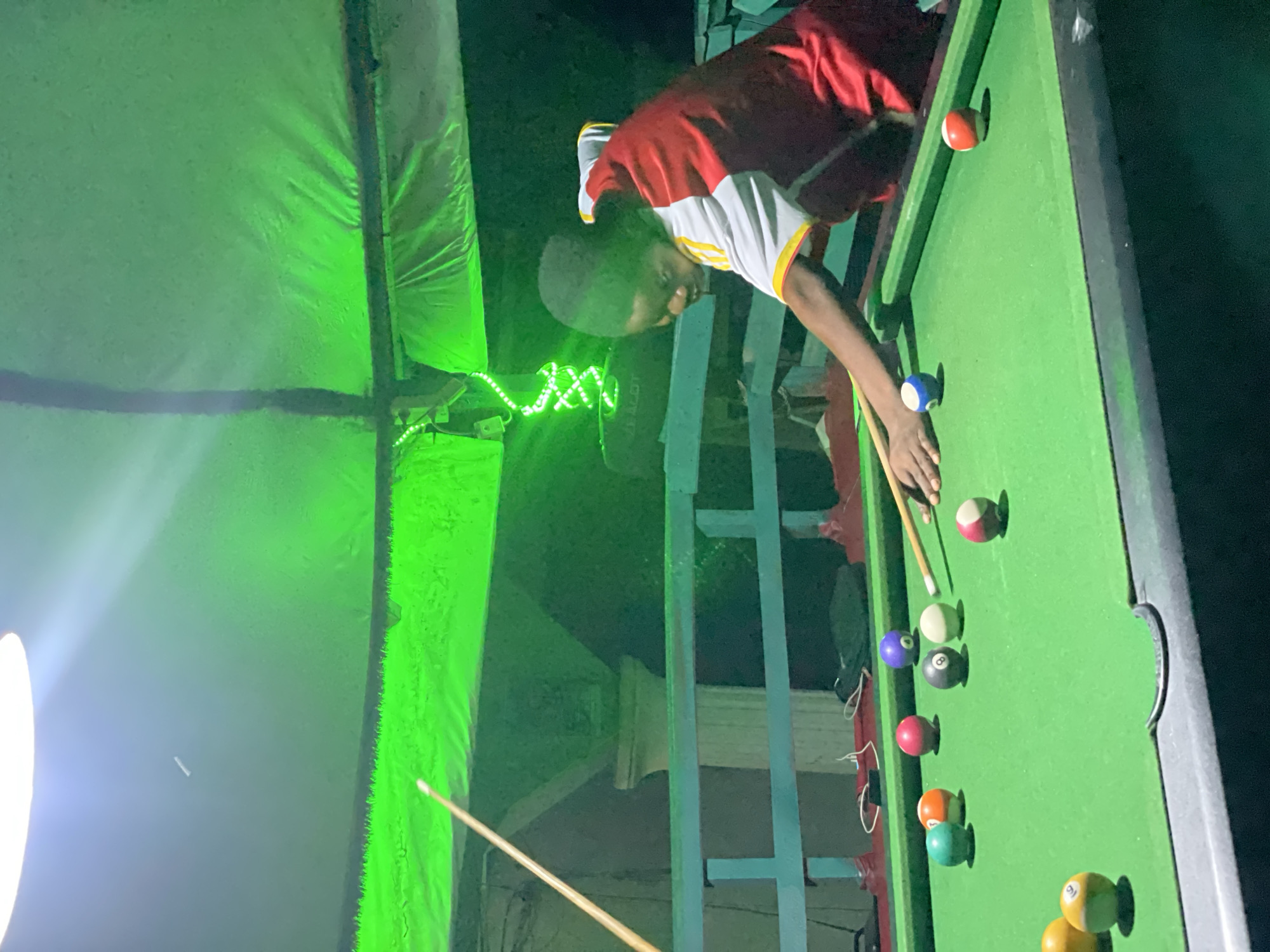 Evening billiards game captured at Lokoja recreational facility