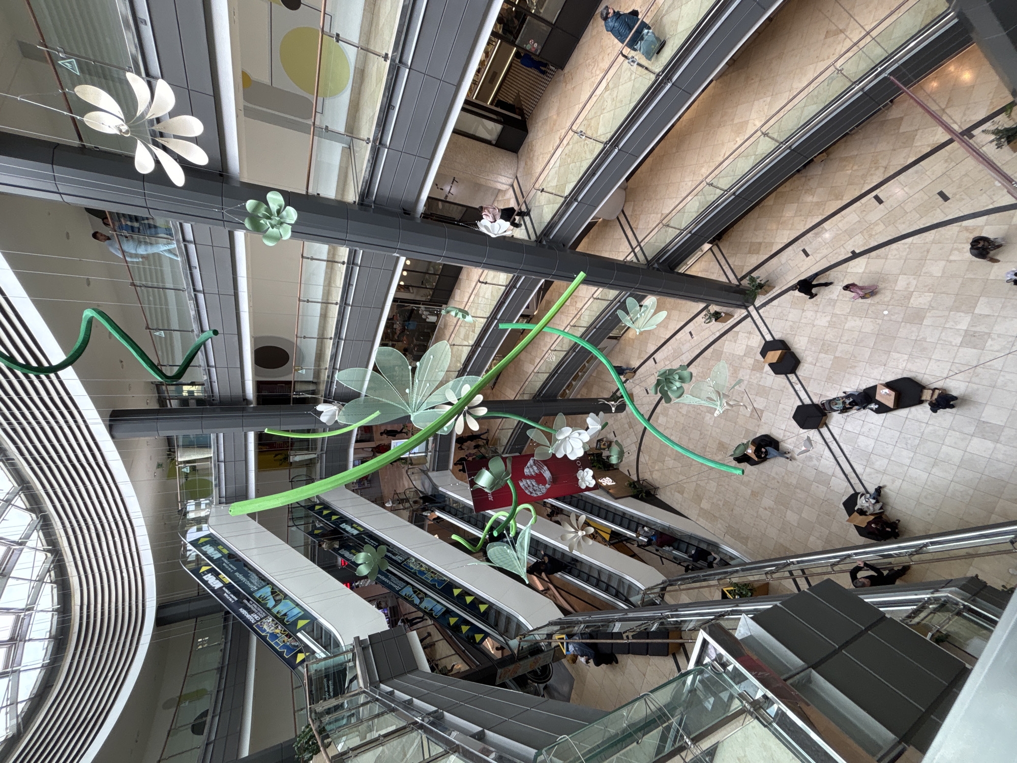 Shoppers navigate multi-level mall interior in Sofia