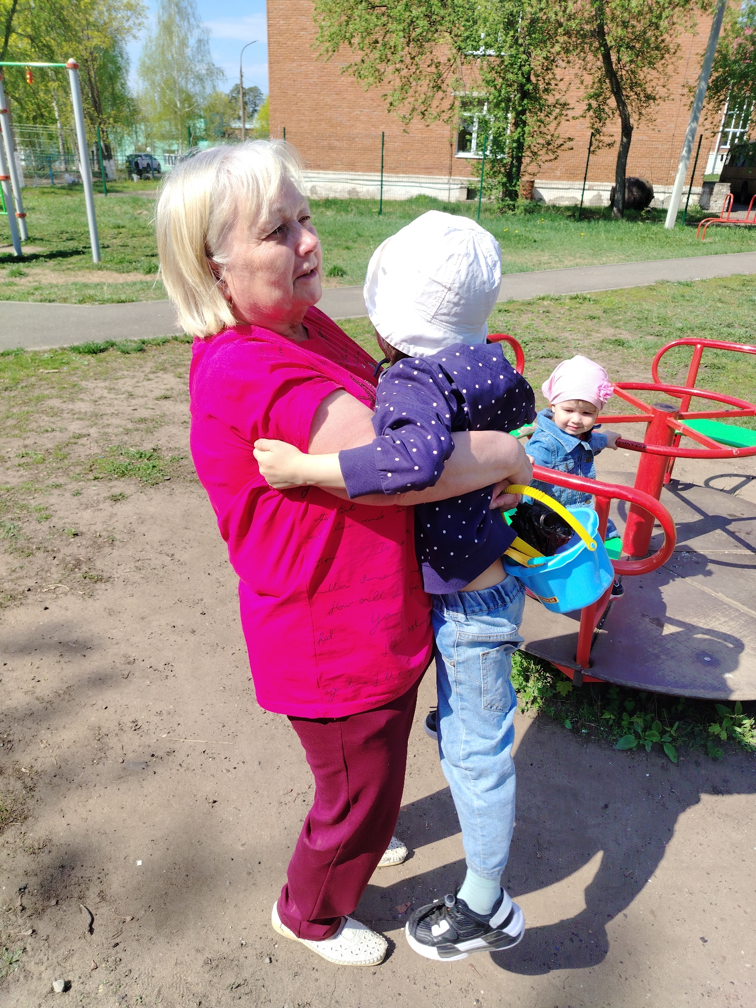 Woman and child photographed during morning outing in Noviy, Russia