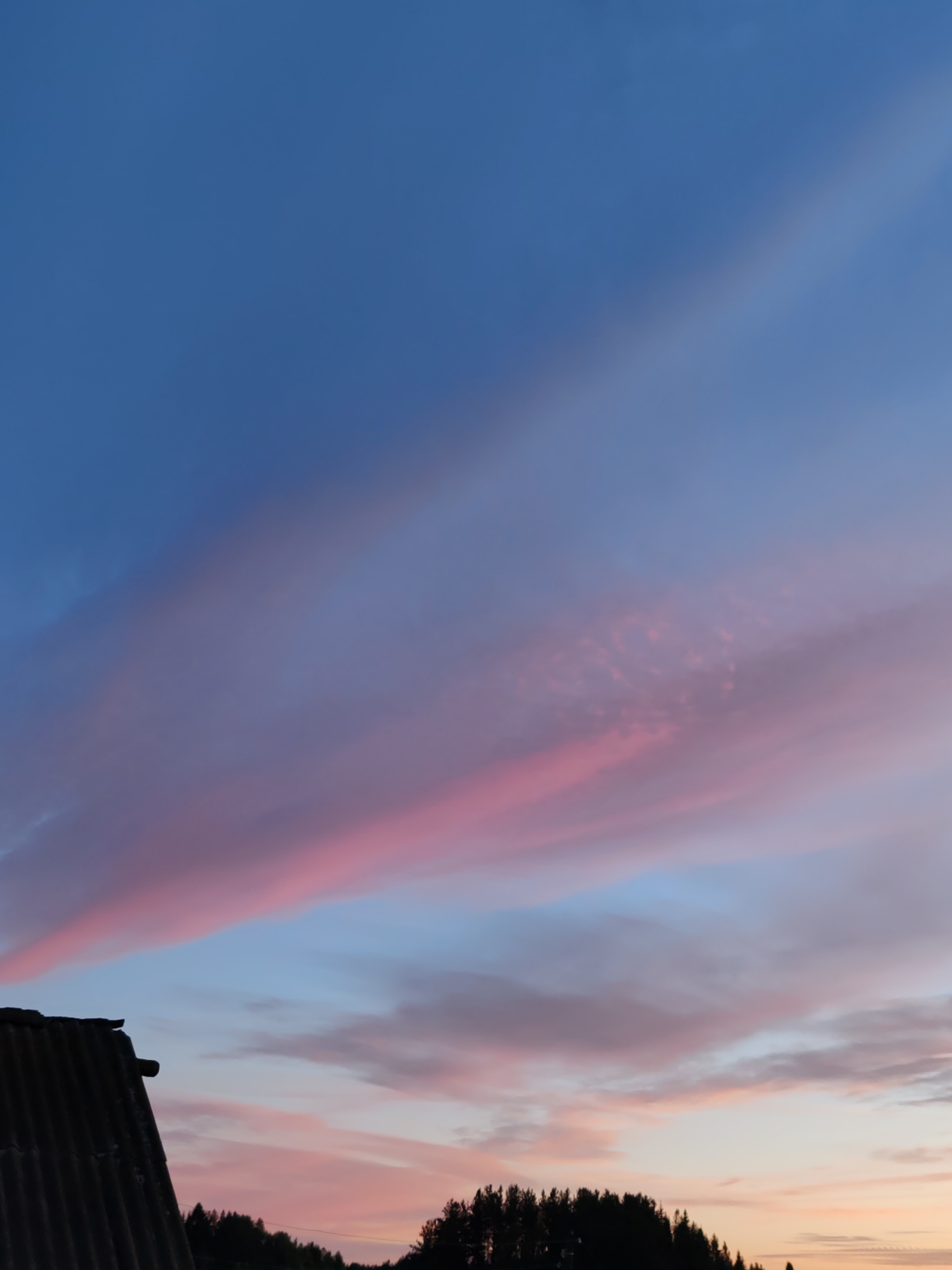 Dusk sky over rural Chukhlem, crescent moon and pastel clouds