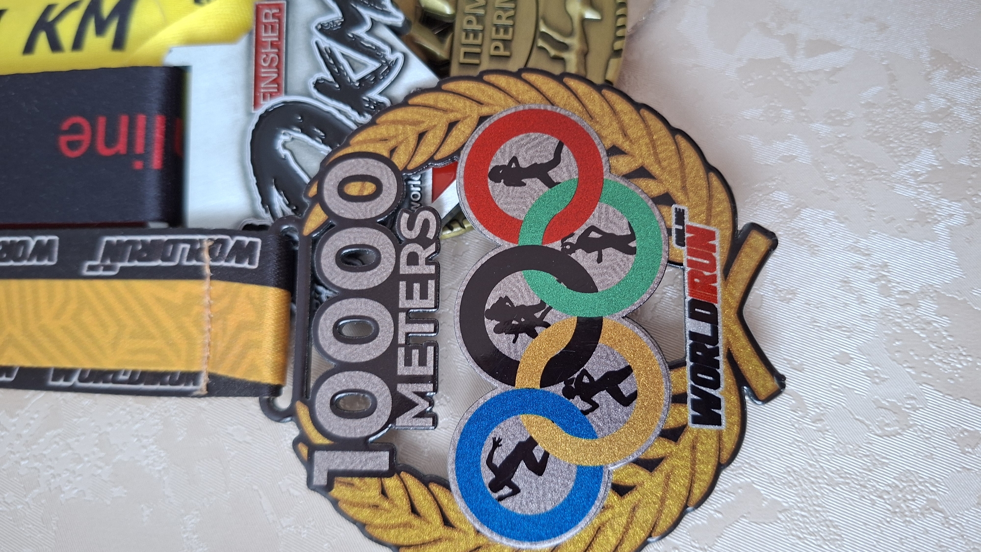 Runner displays medals, relaxes at home in Chaikovsky, Russia