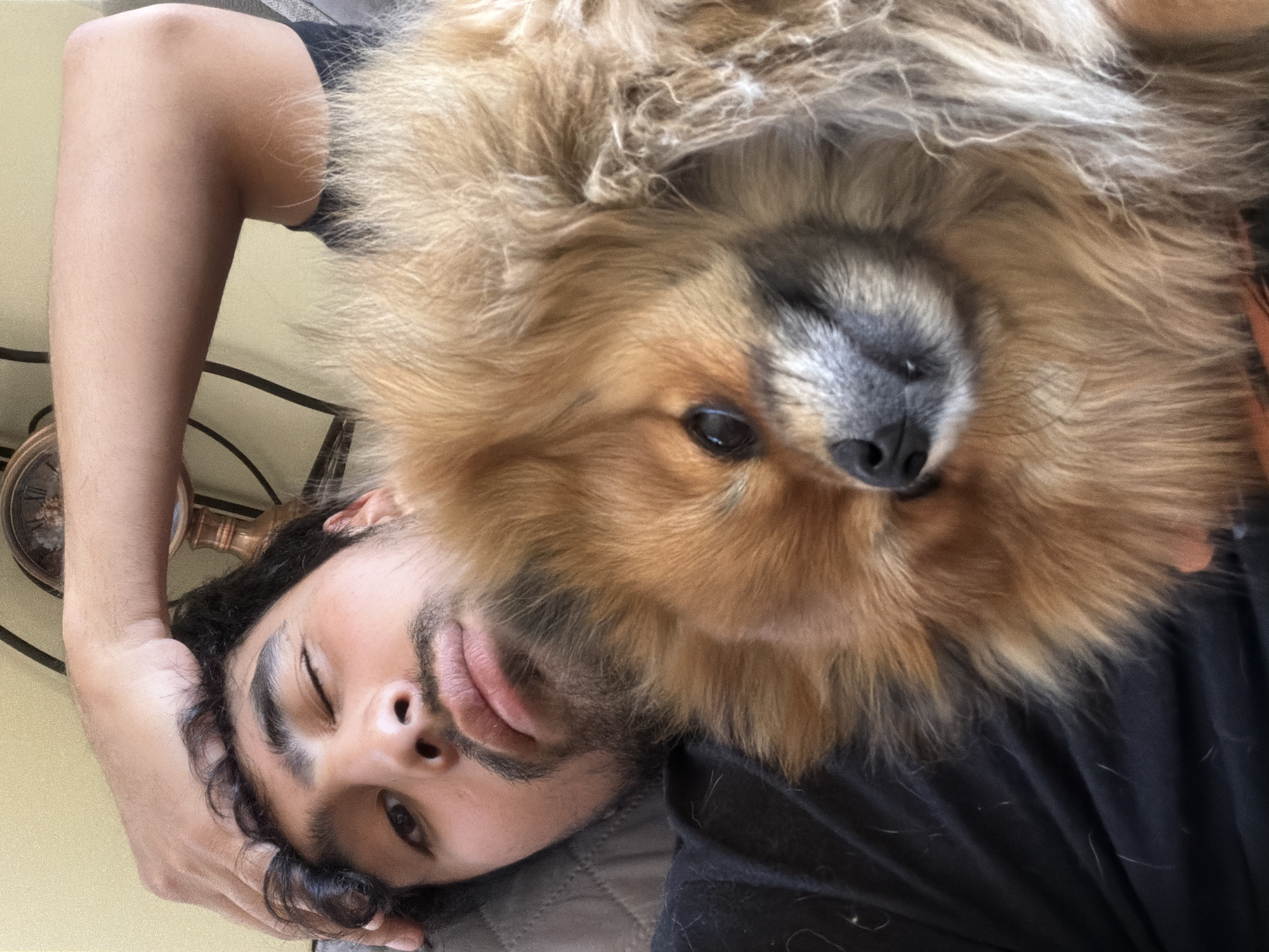 Man winks at camera with dog nearby in Cuautla