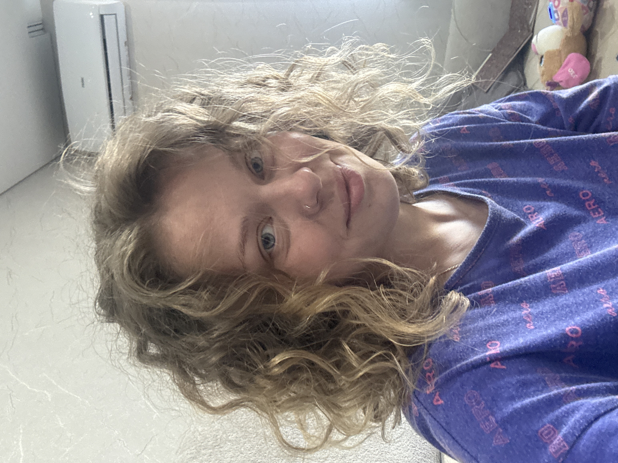 Indoor selfie in Mikhaylovsk, purple AERO t-shirt