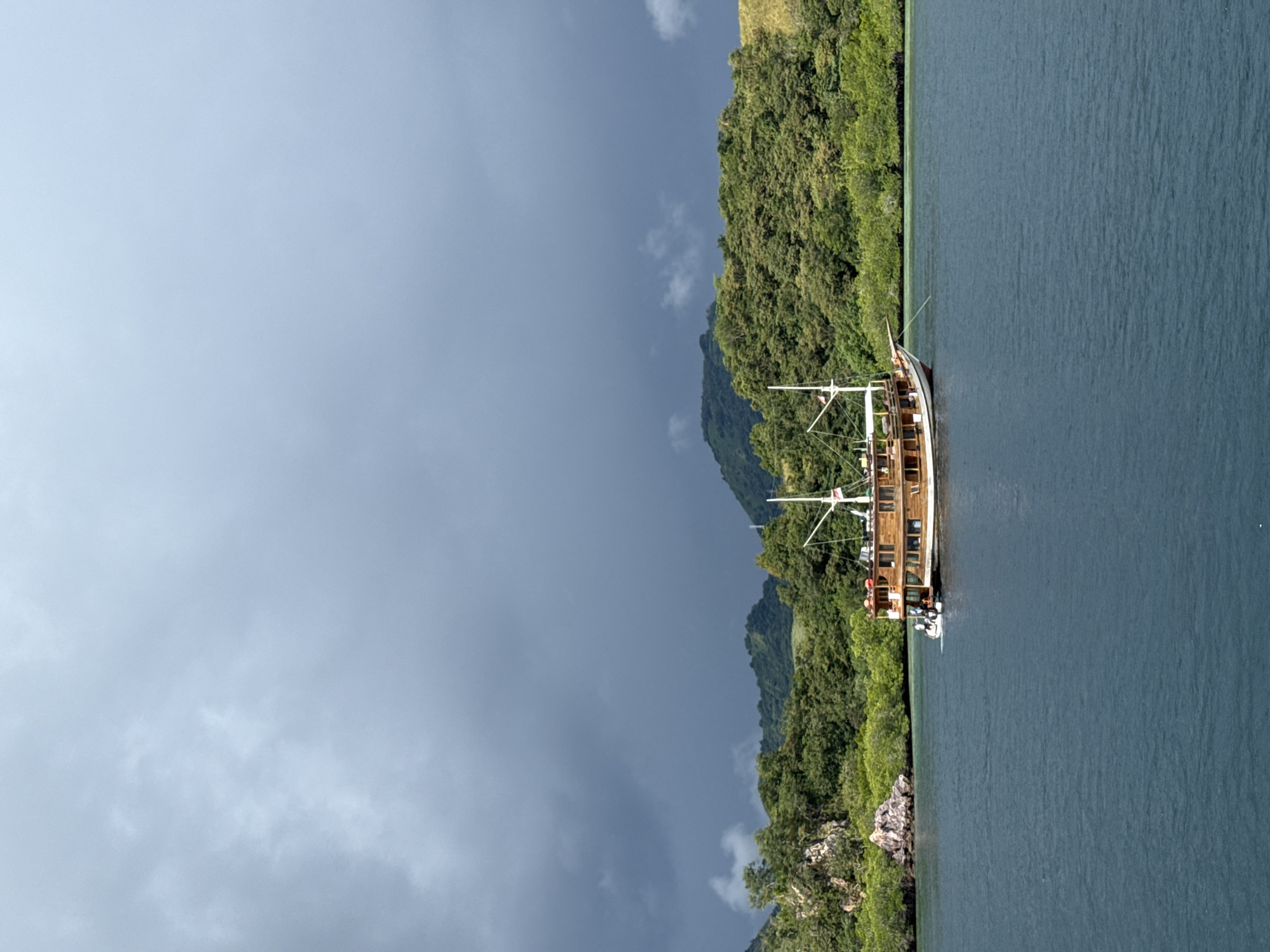 Traditional sailing vessel anchors near Rinca Village, Indonesia