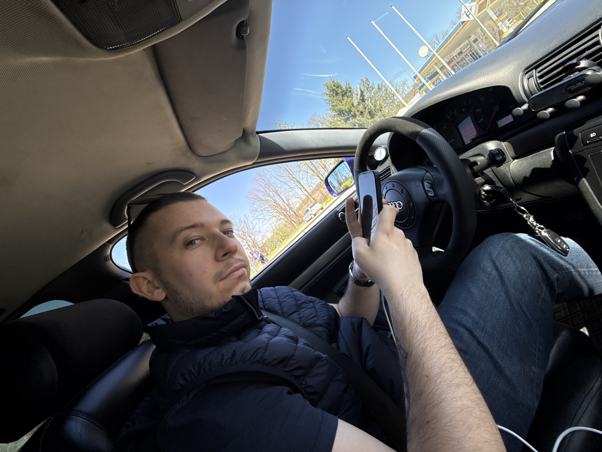 Driver photographing from stationary Audi near Bulgarian gas station