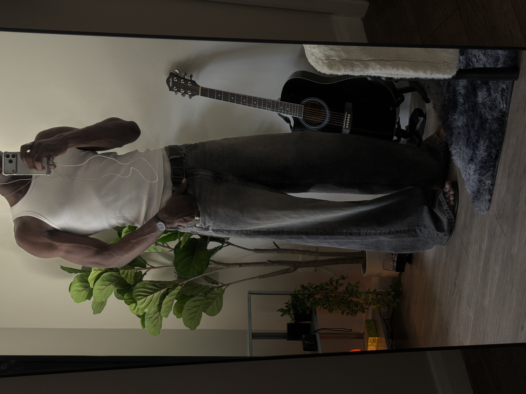 Mirror selfie showing a full outfit in a London room
