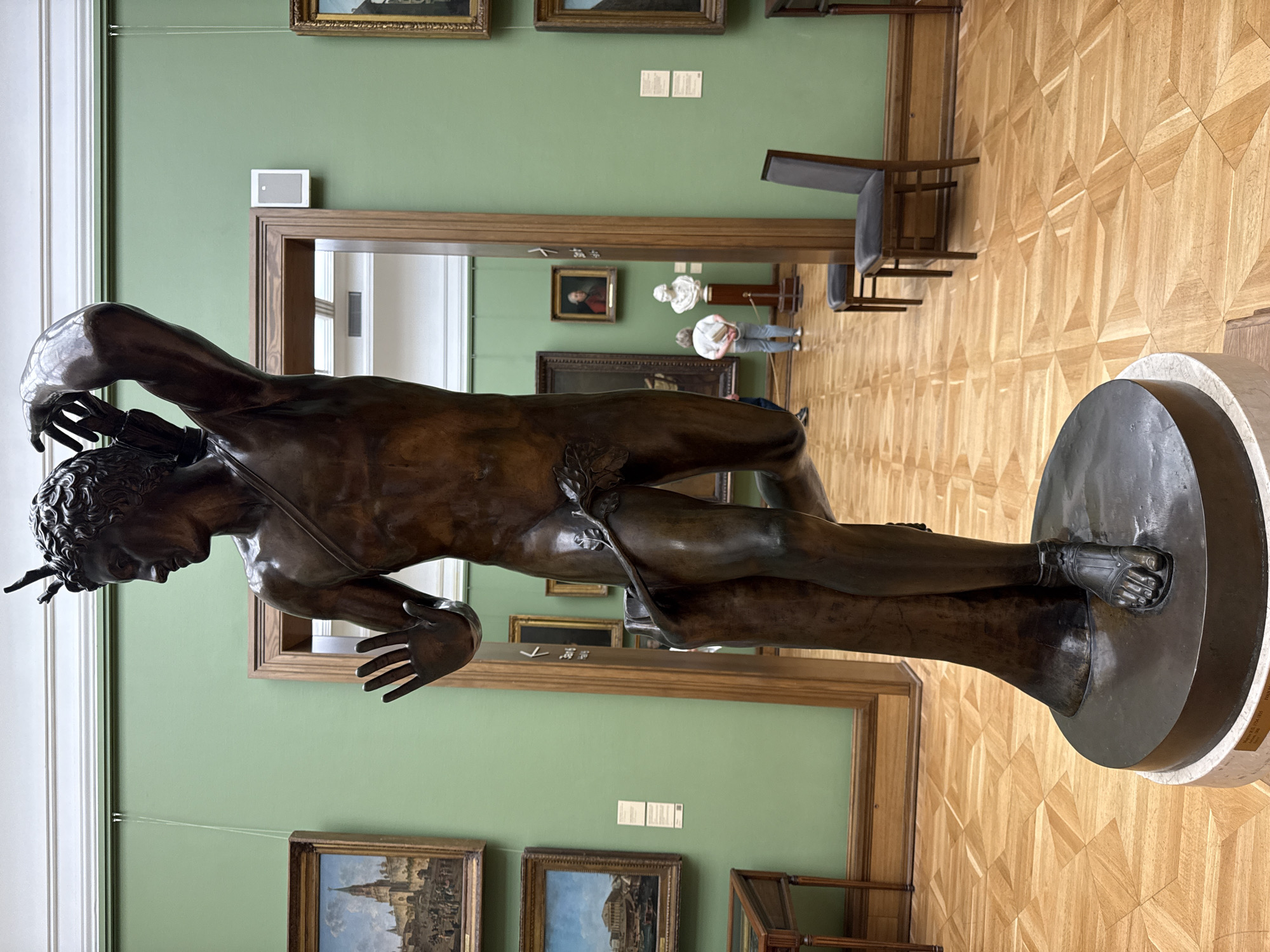 Moscow museum visitor documents artworks and exhibits during morning tour