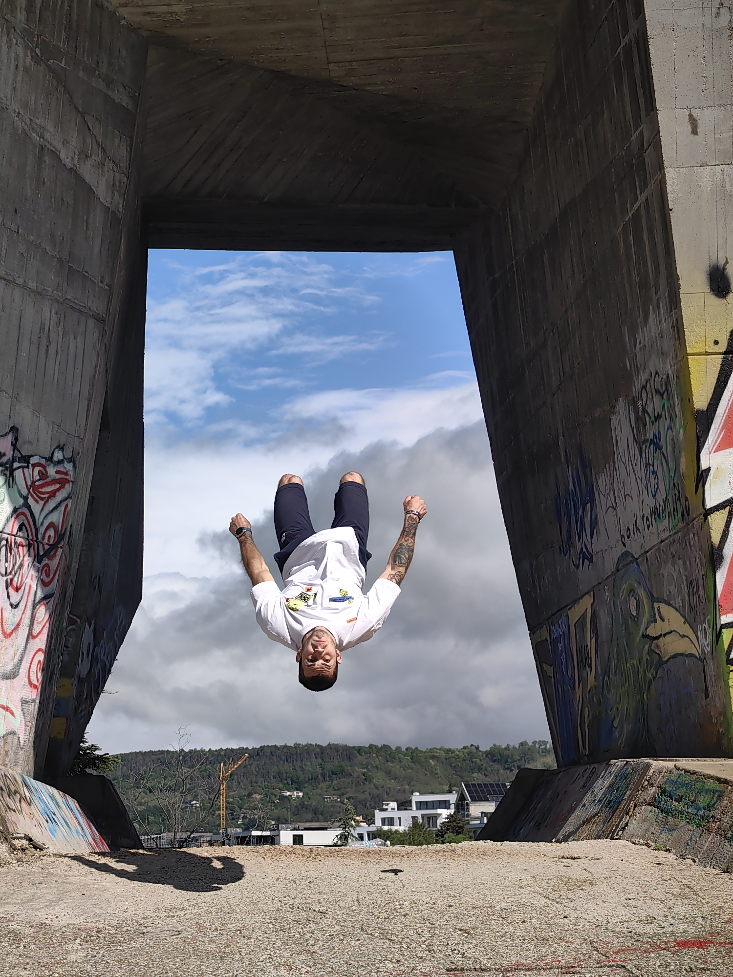 Man performs backflip at concrete structure in Varna