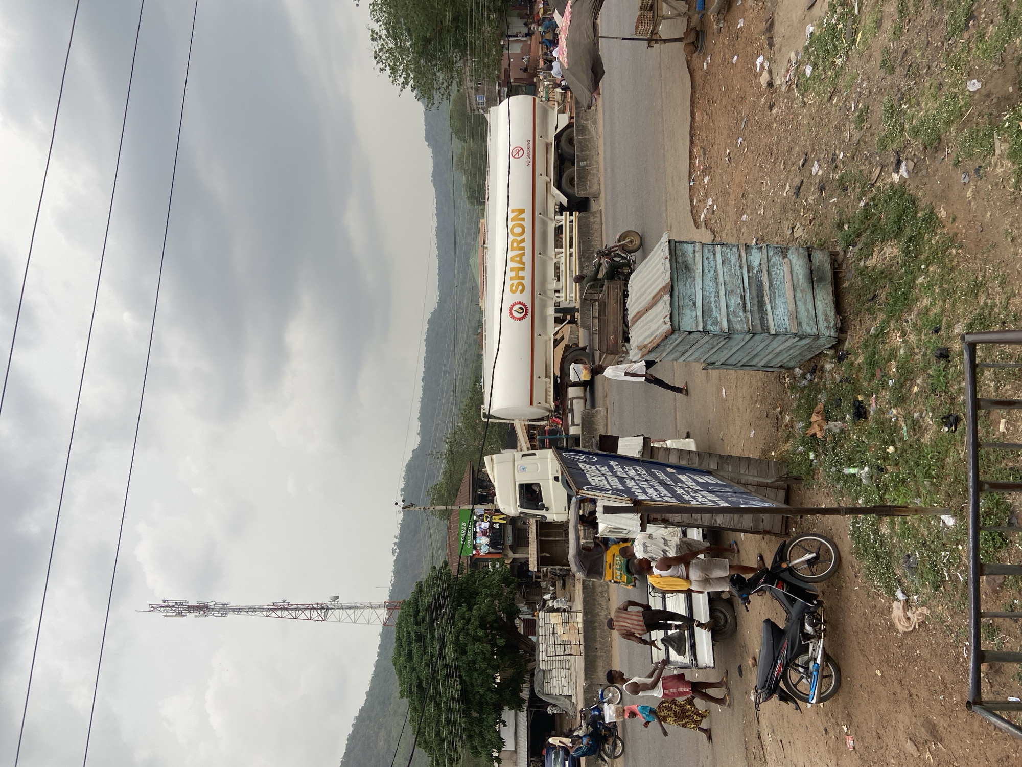 Daily life scenes captured across Lokoja streets and barbershop