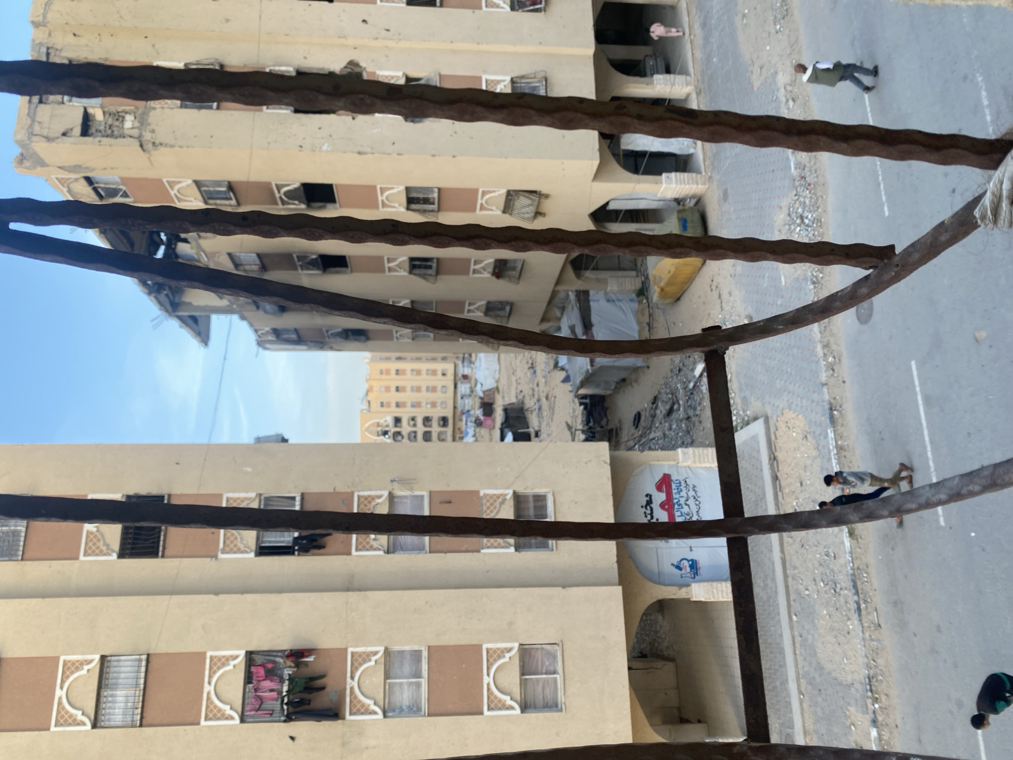 Street scene shows damaged buildings in Khan Yunis