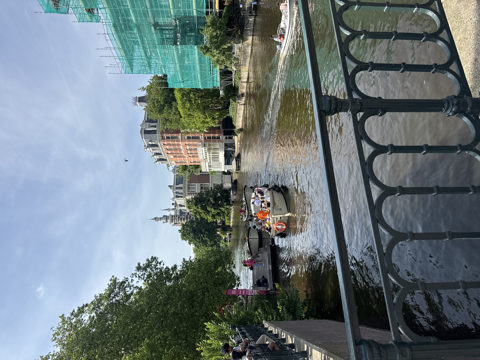 Tourist boats, cafes, walkways documented in central Amsterdam
