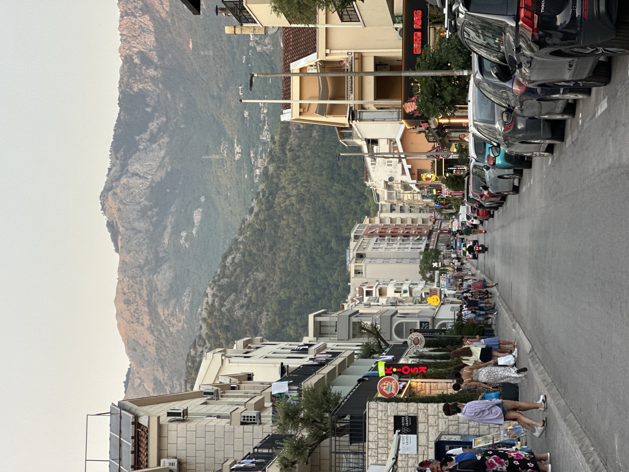 Late afternoon street life along a busy Budva strip