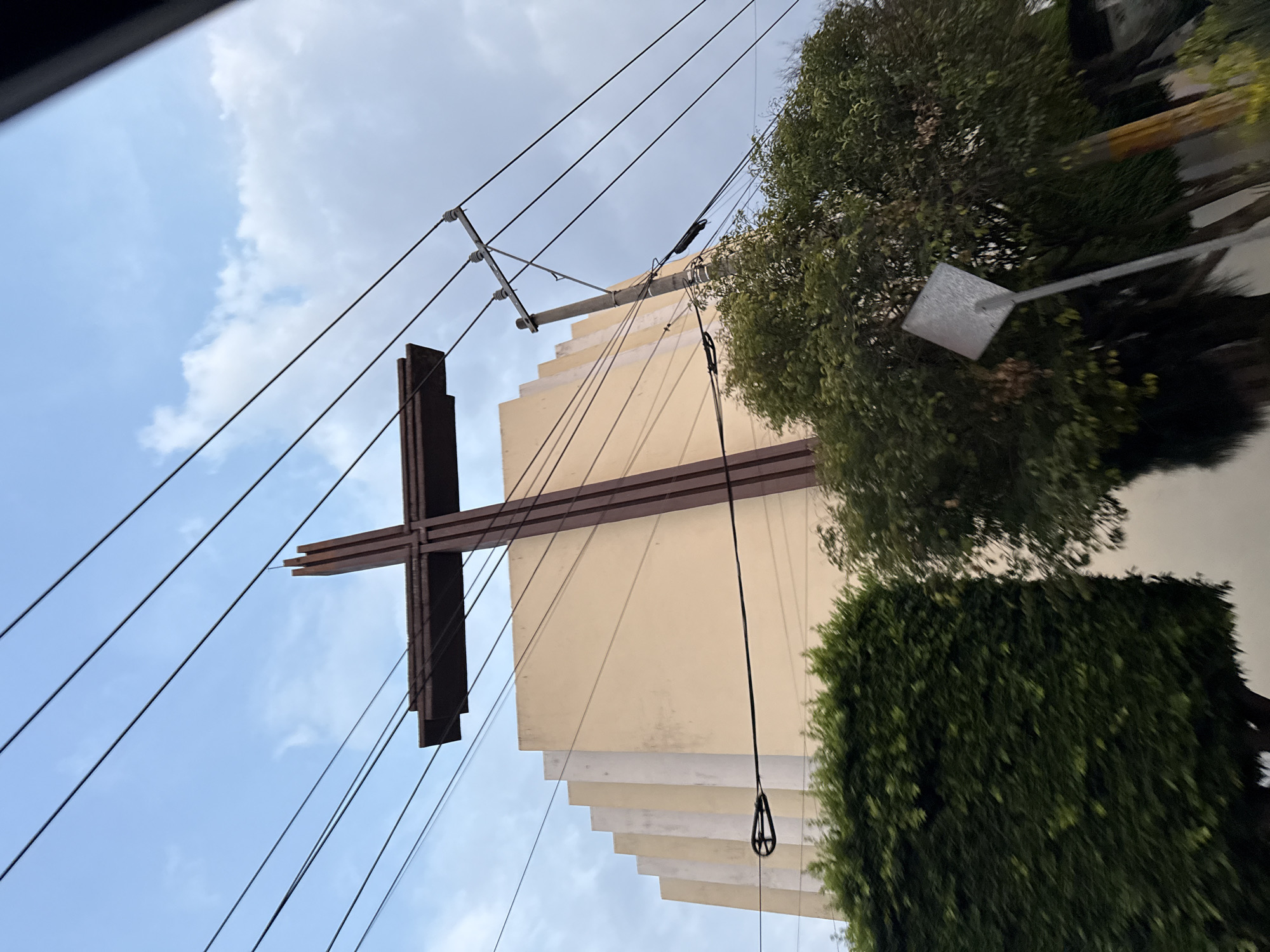 Religious building with metal cross photographed in Puebla, Mexico