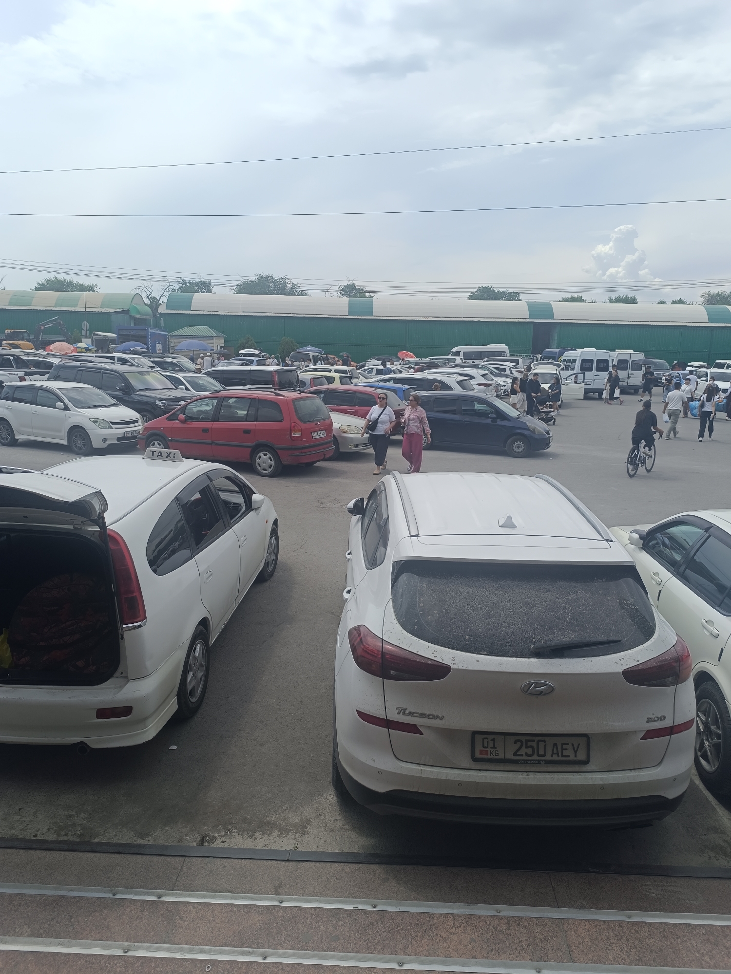Busy urban morning: street work, market activity, and vehicles