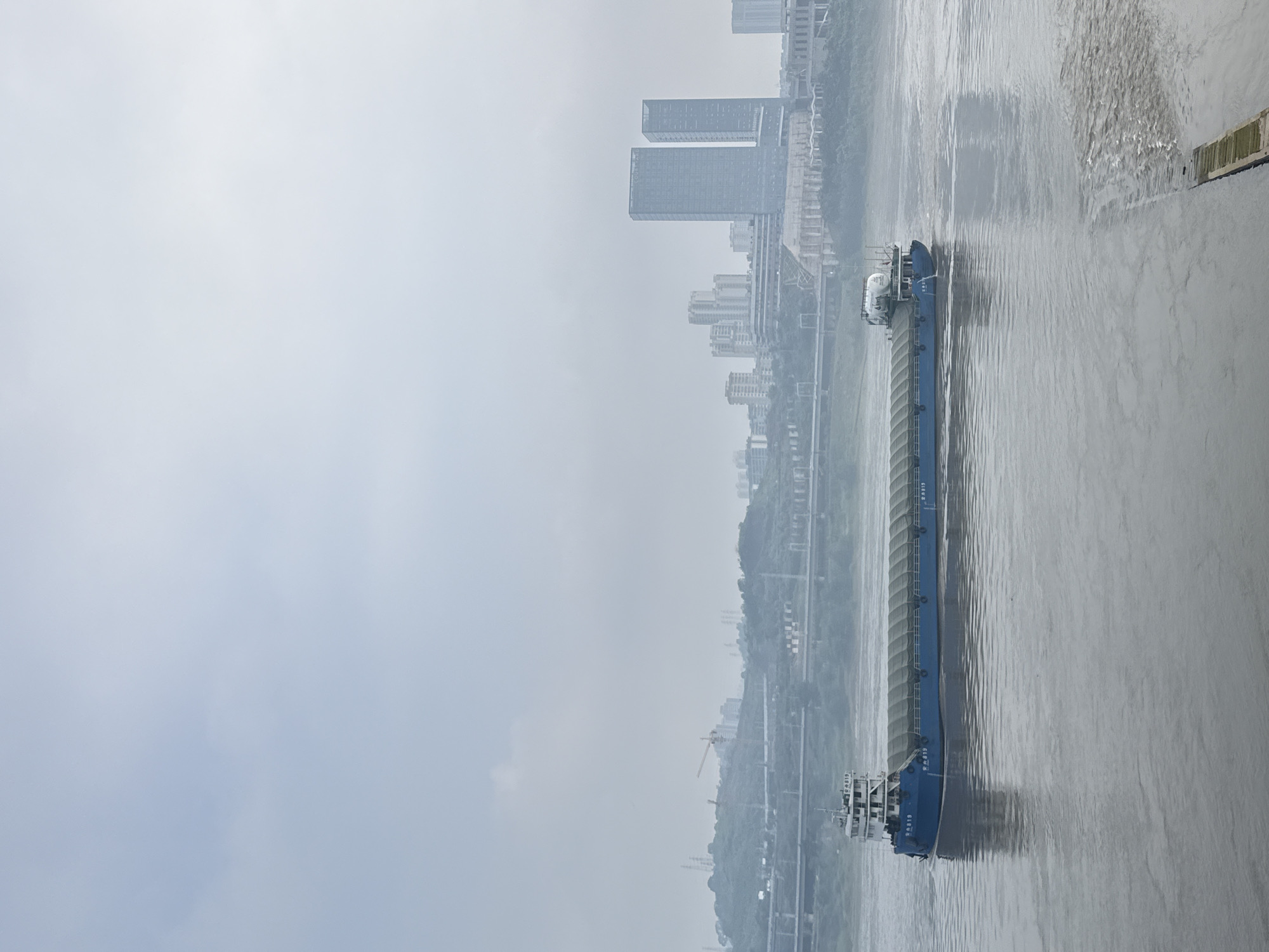 Quiet morning activity along Jiangjin's riverside promenade