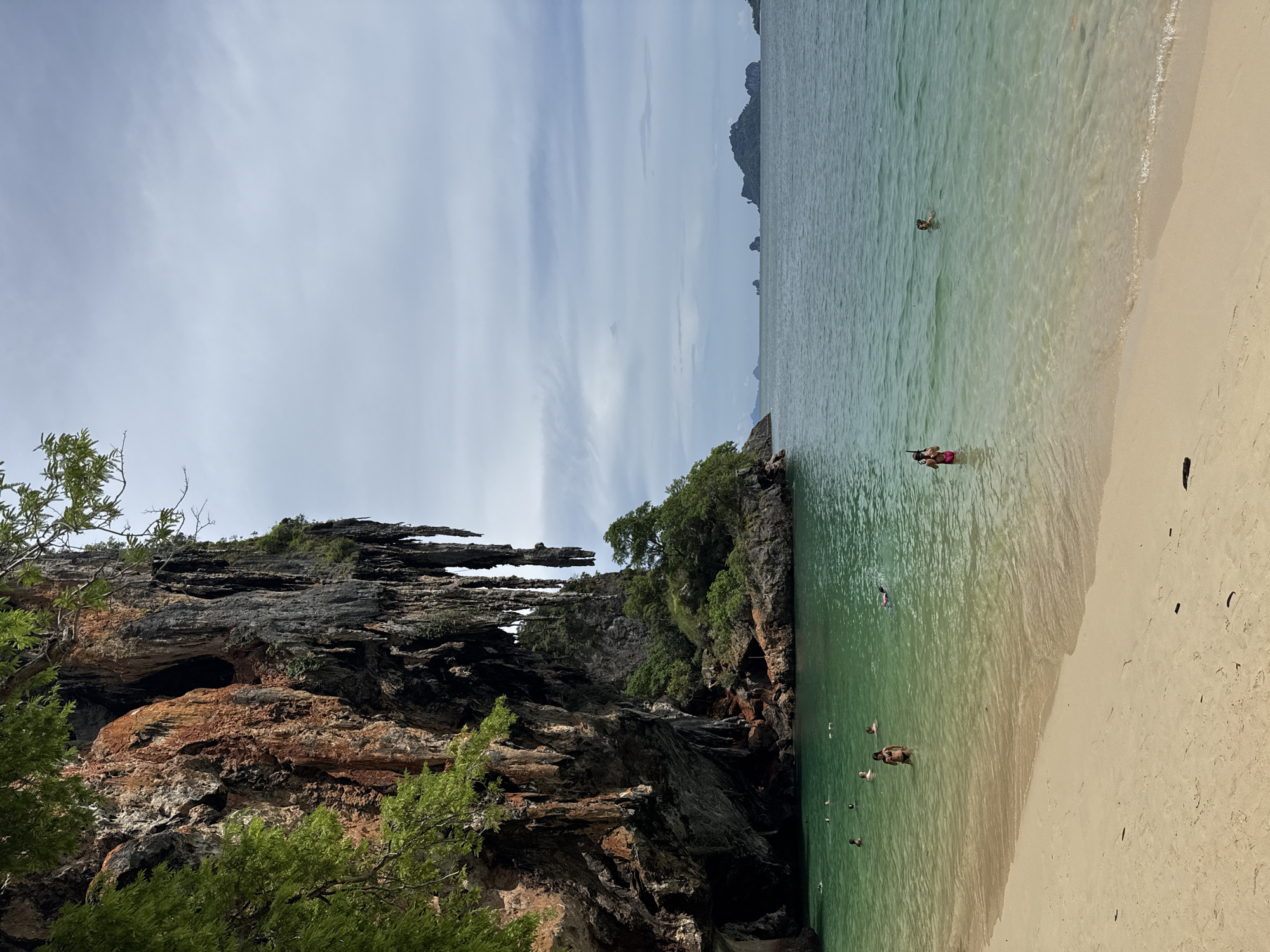 Caves, karst cliffs, and calm waters around Railay Beach, Krabi