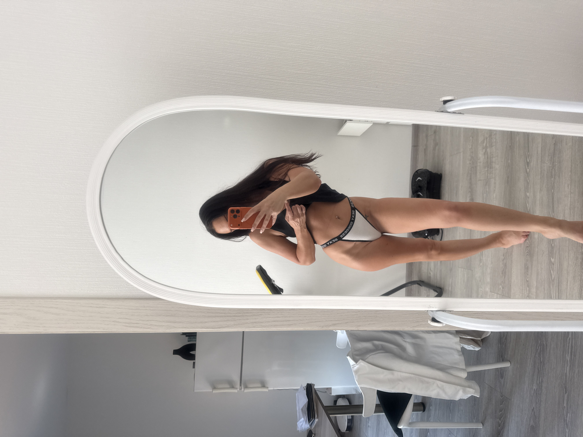 Mirror selfie in a Zapadny home, athletic wear