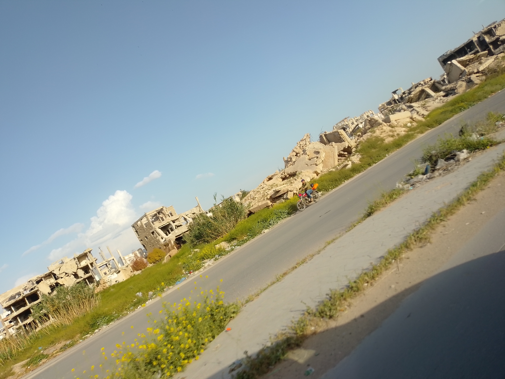 Vehicle spotted in damaged area amid clear skies