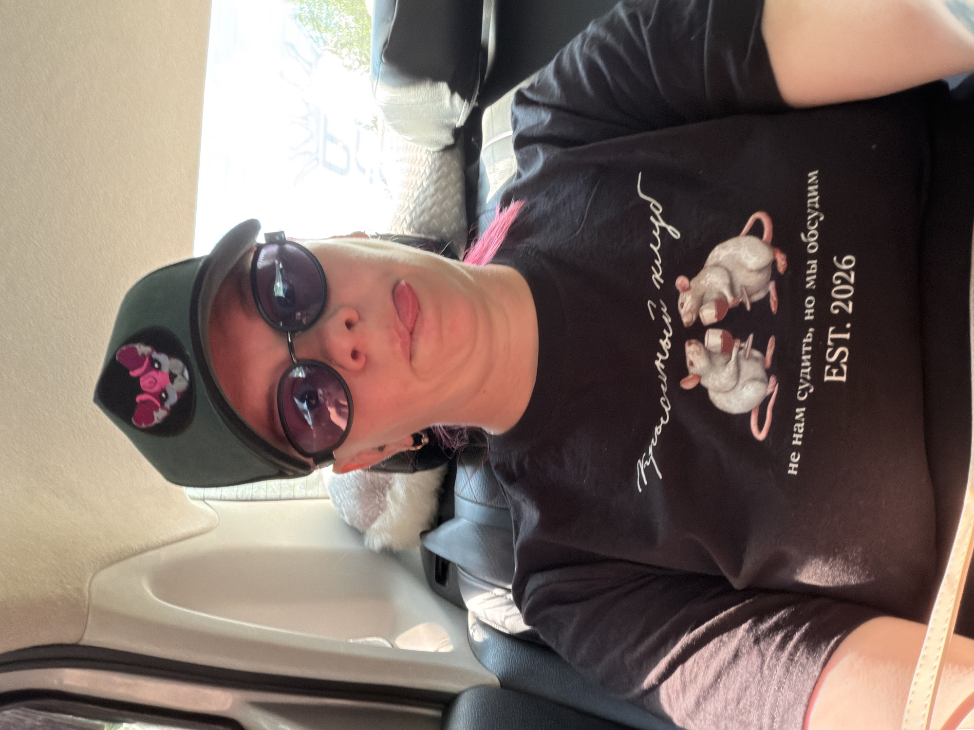 Back-seat selfies in Chaikovsky, same cap and shades throughout