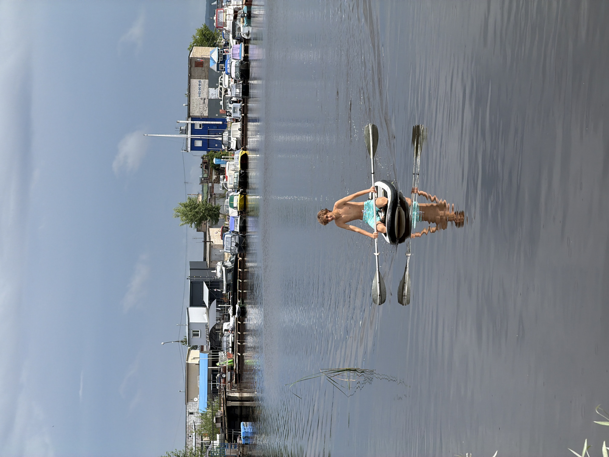 Paddleboarding on calm marina water in Chaikovsky, Russia