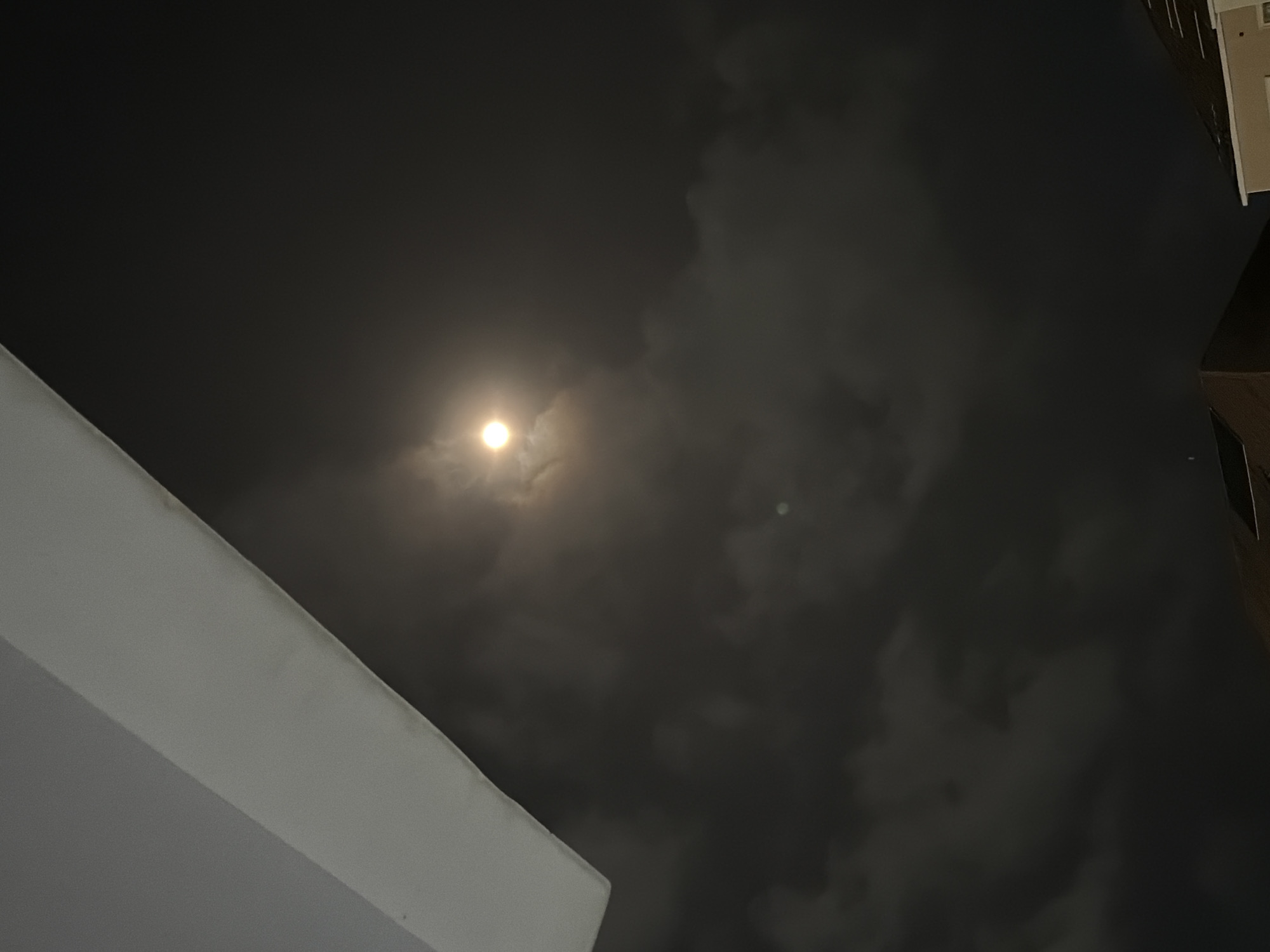 Bright moon partially obscured by clouds observed in Nigeria