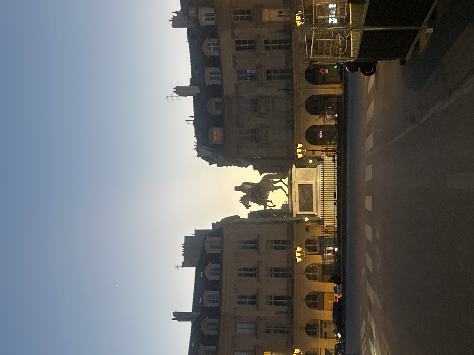 Urban evening scenes: statue at dusk, mirror selfie captured