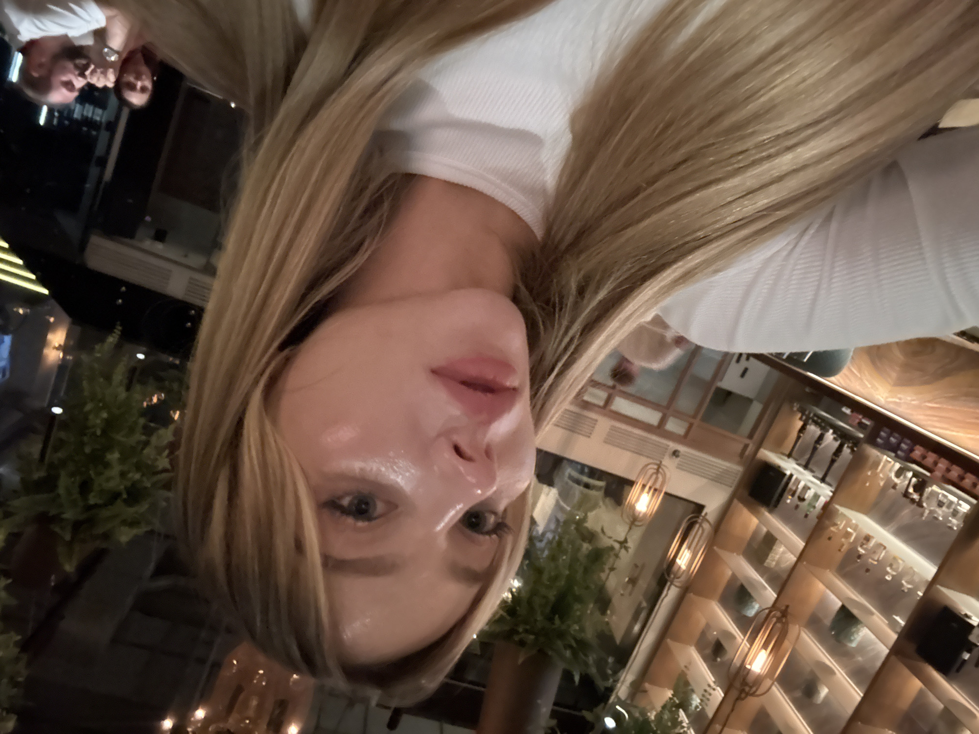 Woman takes selfie at Moscow bar or restaurant