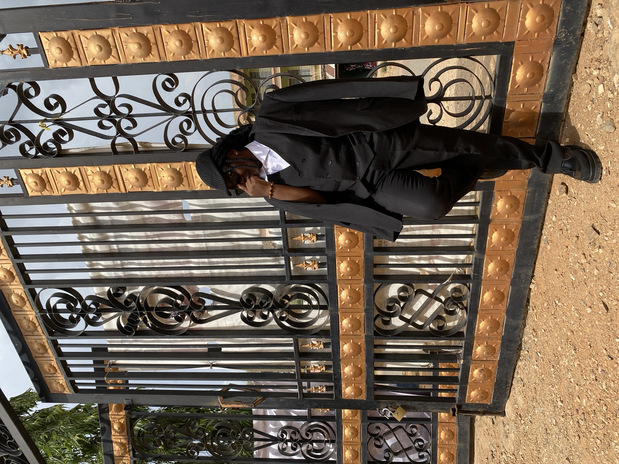 Photo session at ornate gate in Gwong, Nigeria