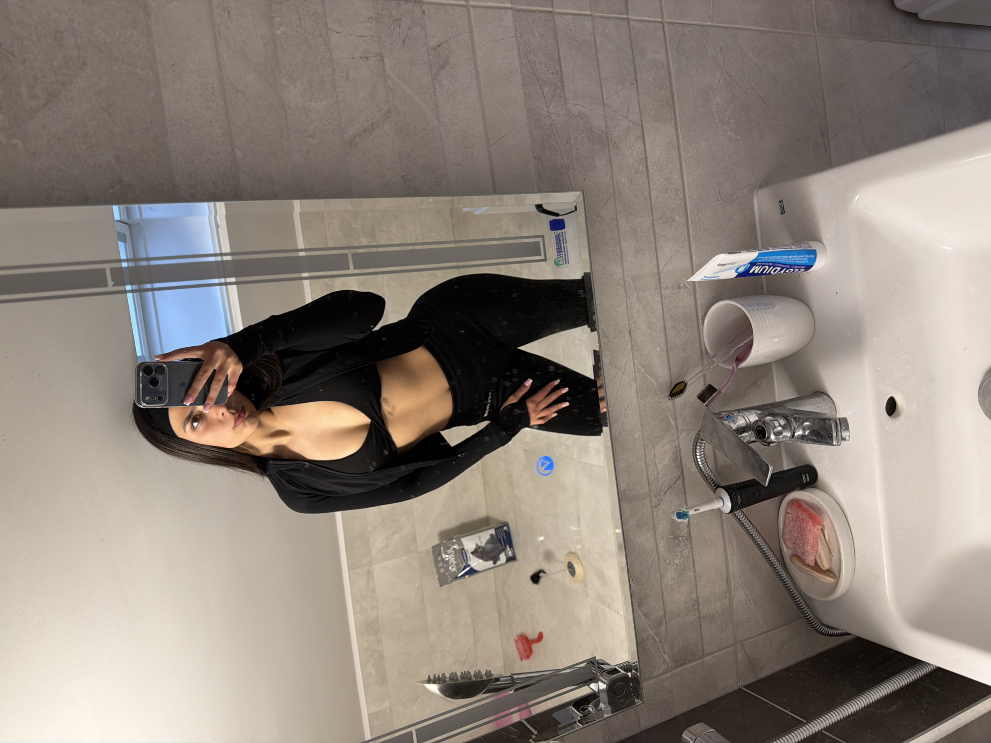 Woman takes mirror selfie in Gabrovo bathroom