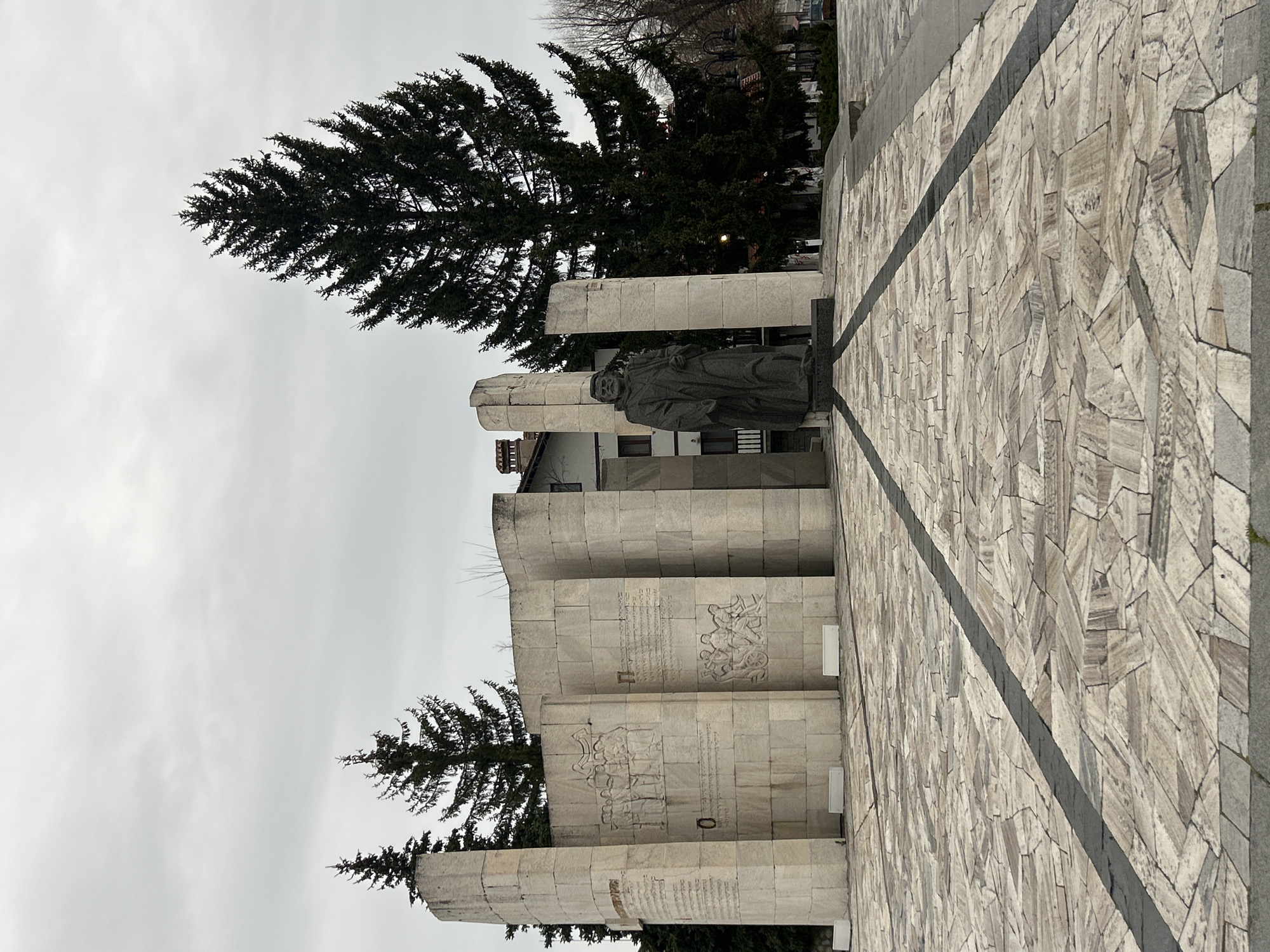 Tourist documents historic landmarks in Bansko Bulgaria morning walk