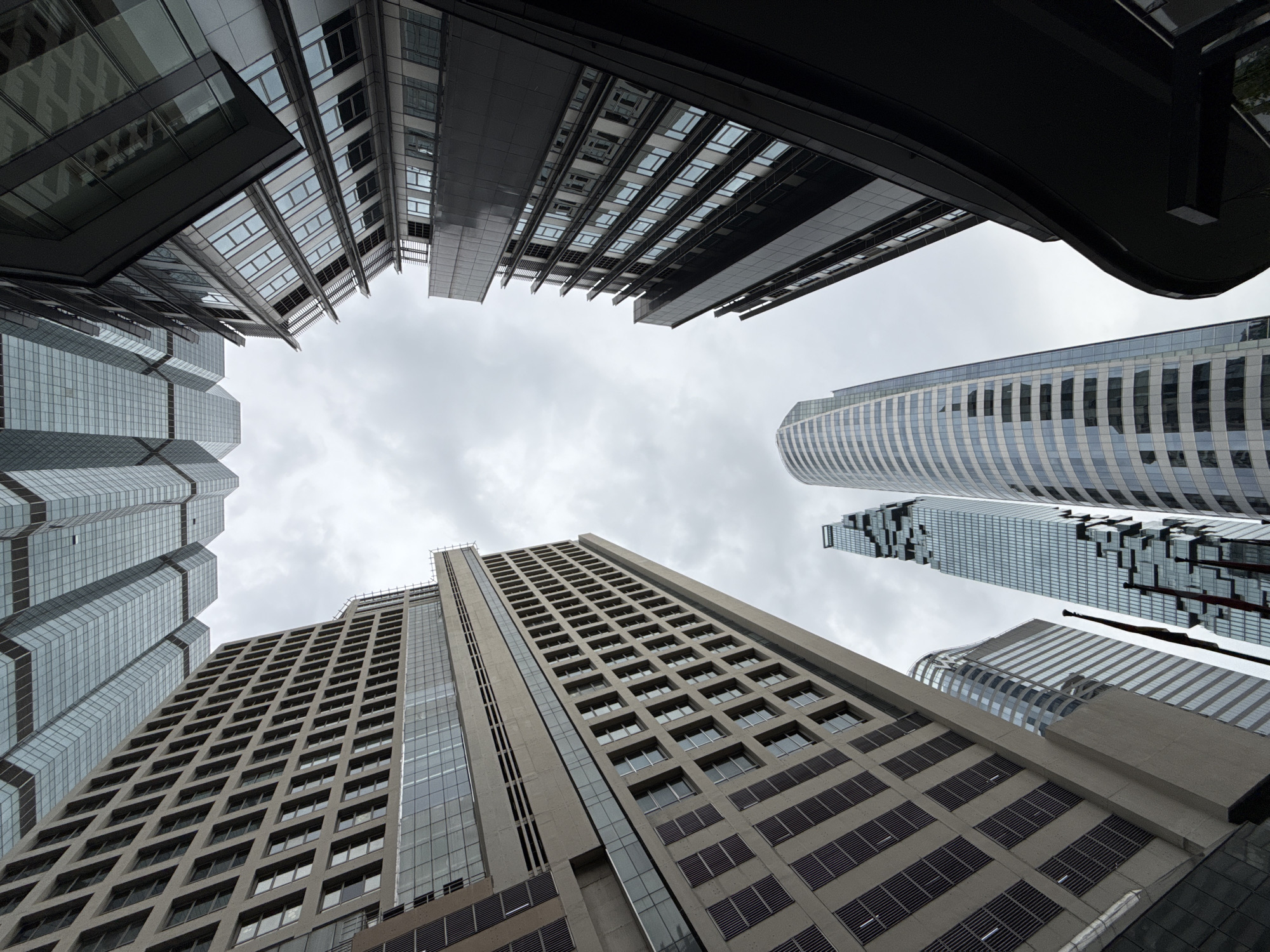 Looking up at Bangkok's skyline from street level