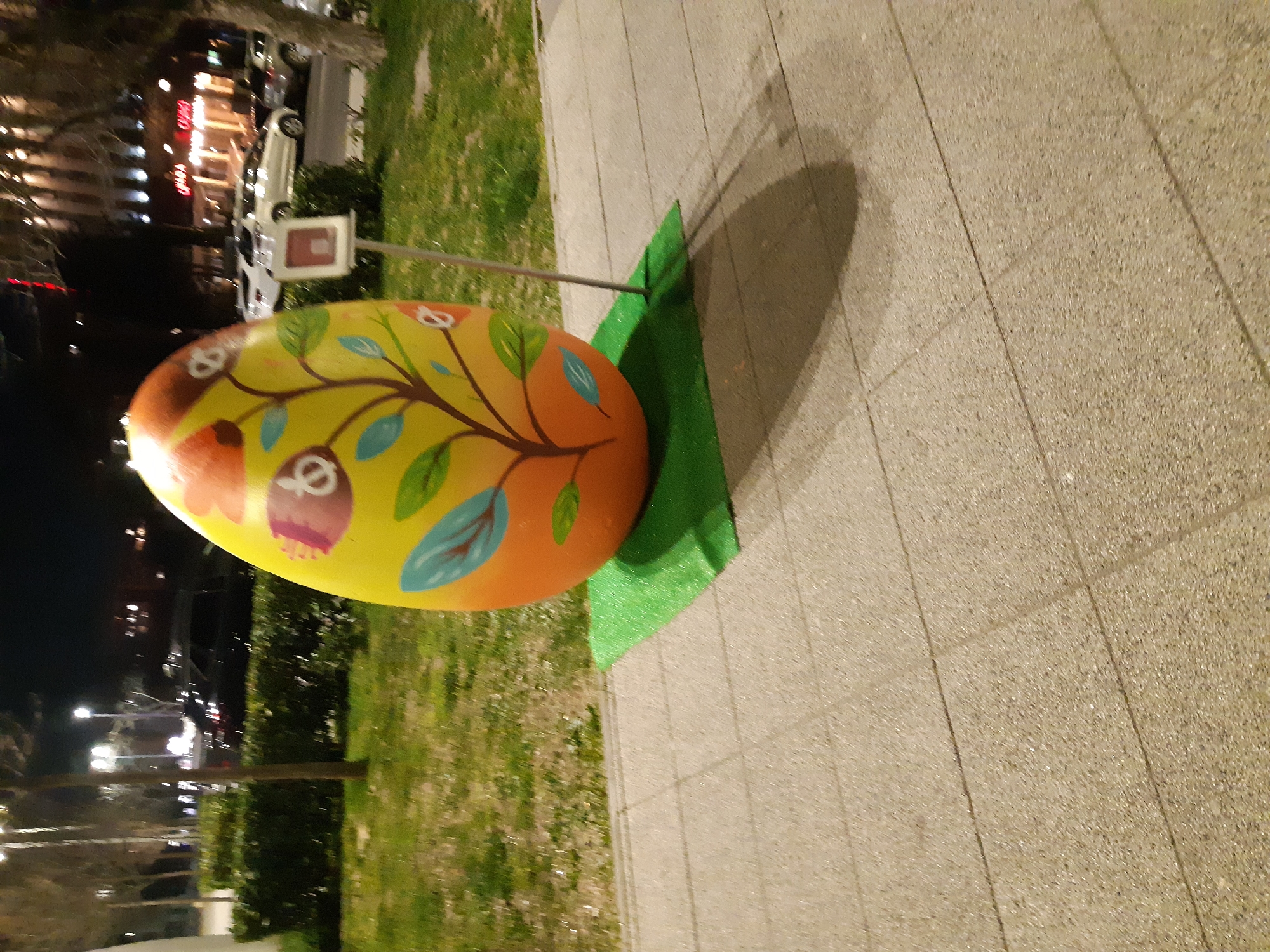 Decorated Easter egg sculpture displayed on Plovdiv sidewalk