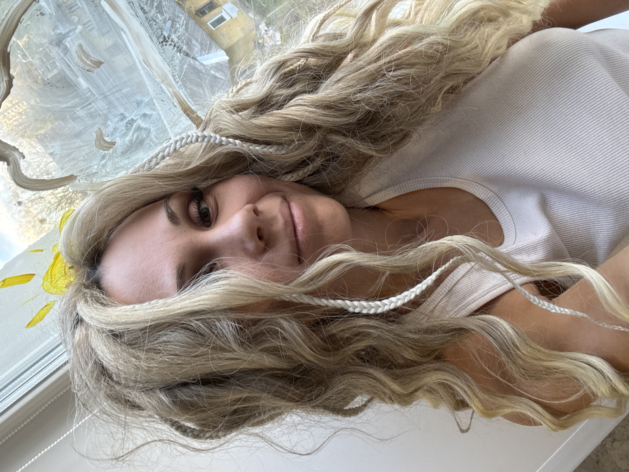 Woman documents afternoon selfie session overlooking Rusanovo residential area