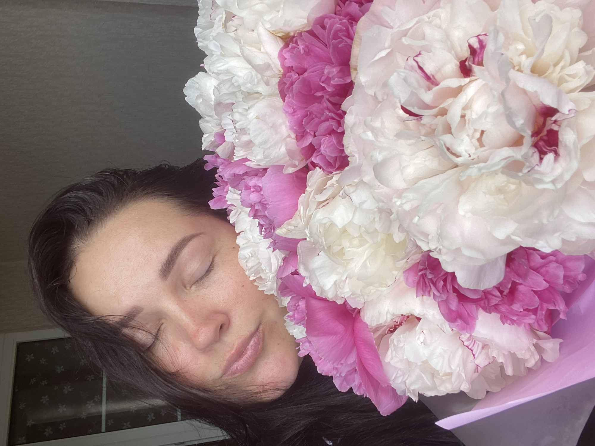 Woman poses with peony bouquet in weekend moment, Sochi