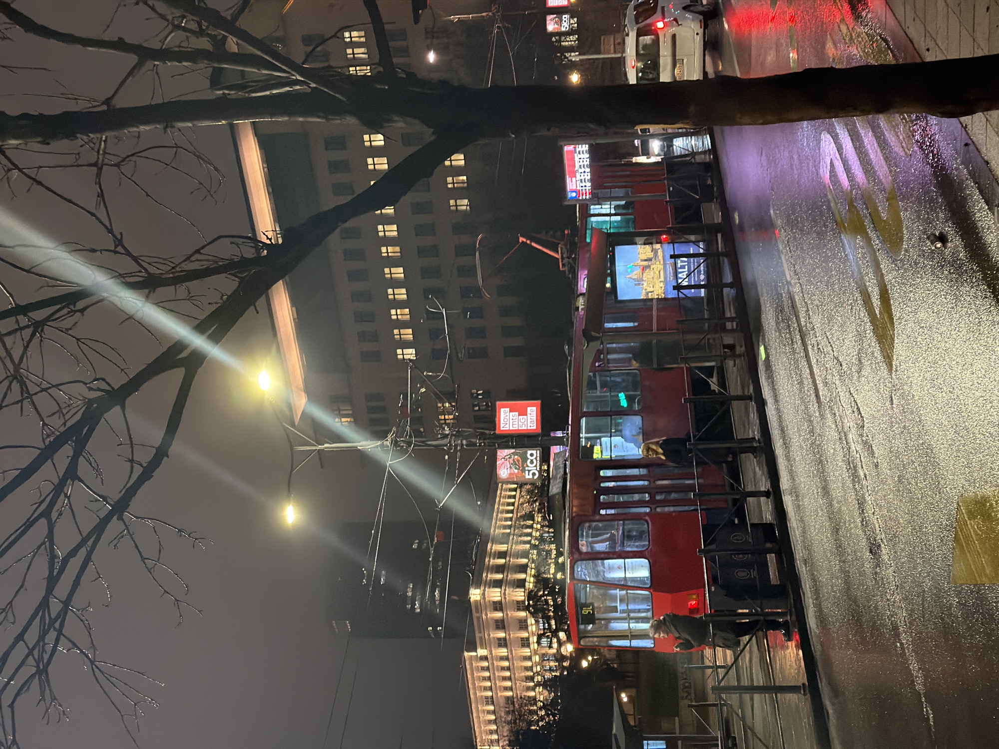 Evening tram commute documented during rainy night in Belgrade