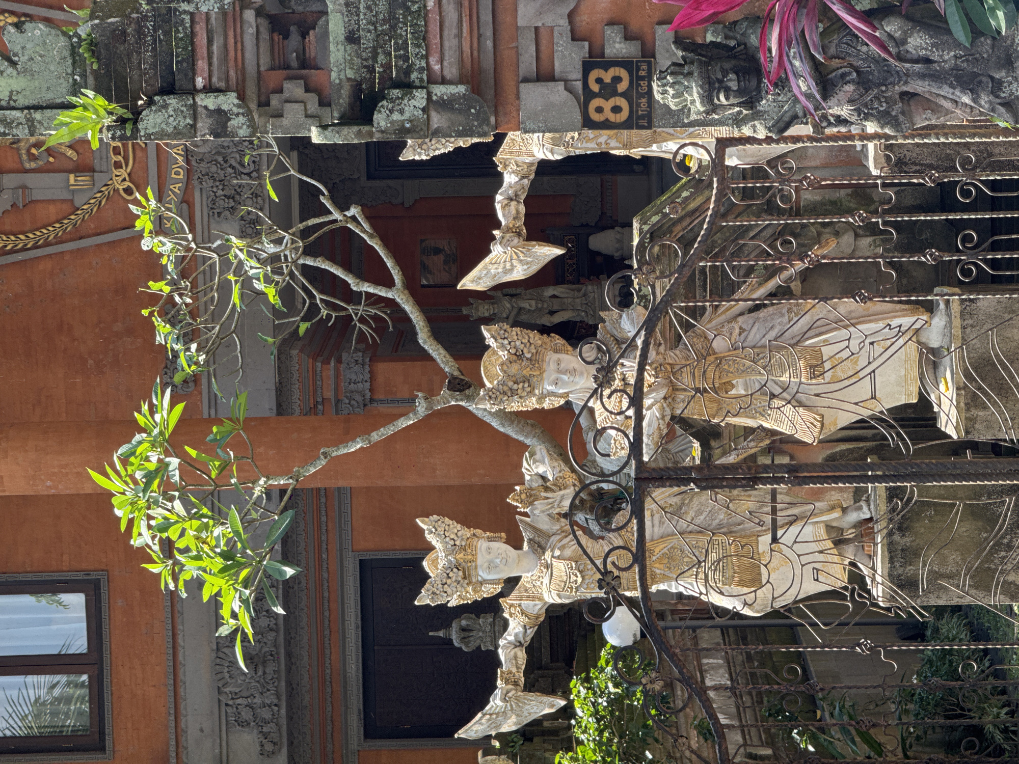 Deep inside Ubud's temple grounds, stone gods and banyan roots
