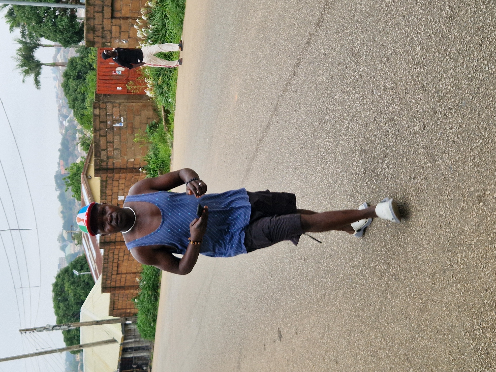 Morning street activity in a busy West African urban neighborhood