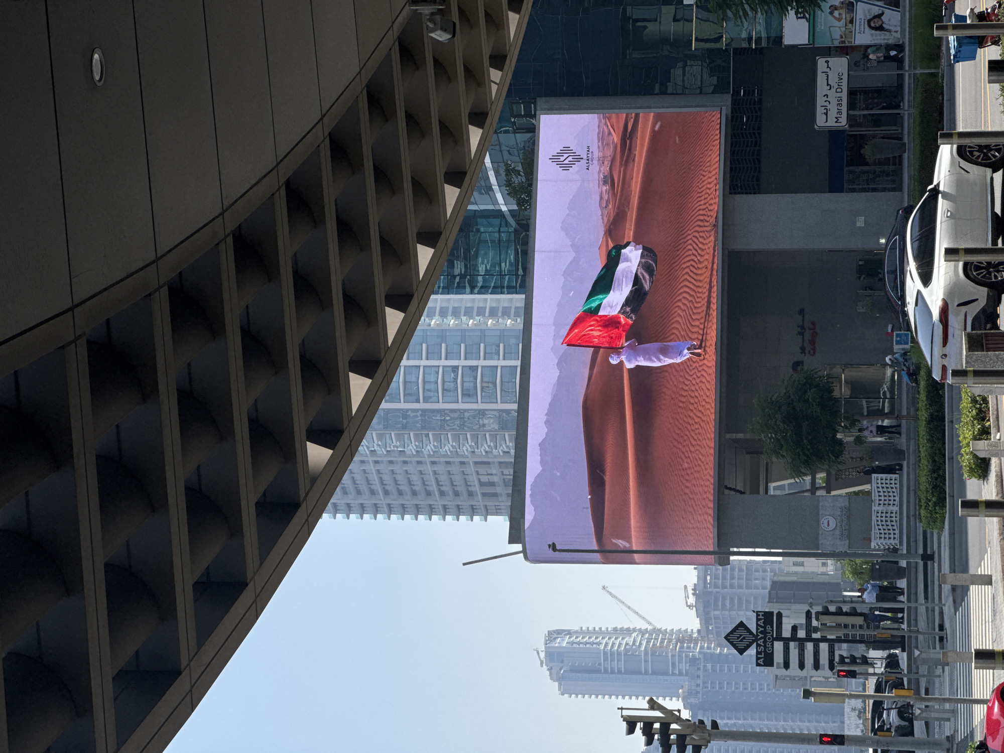 Alsayyah Group UAE flag advertisement displayed on Business Bay LED screen