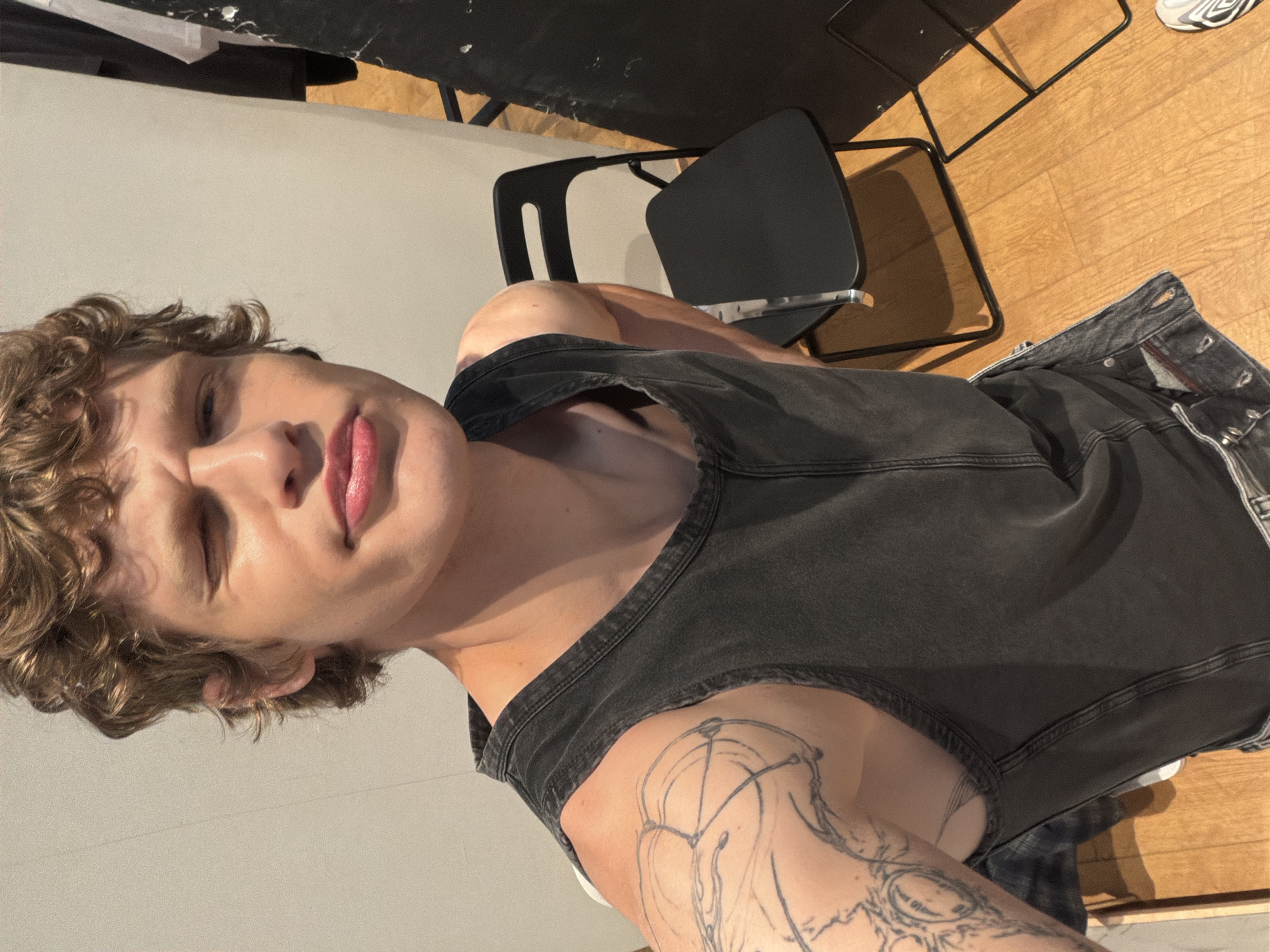 Person with blonde hair and tattoo photographed Thursday morning