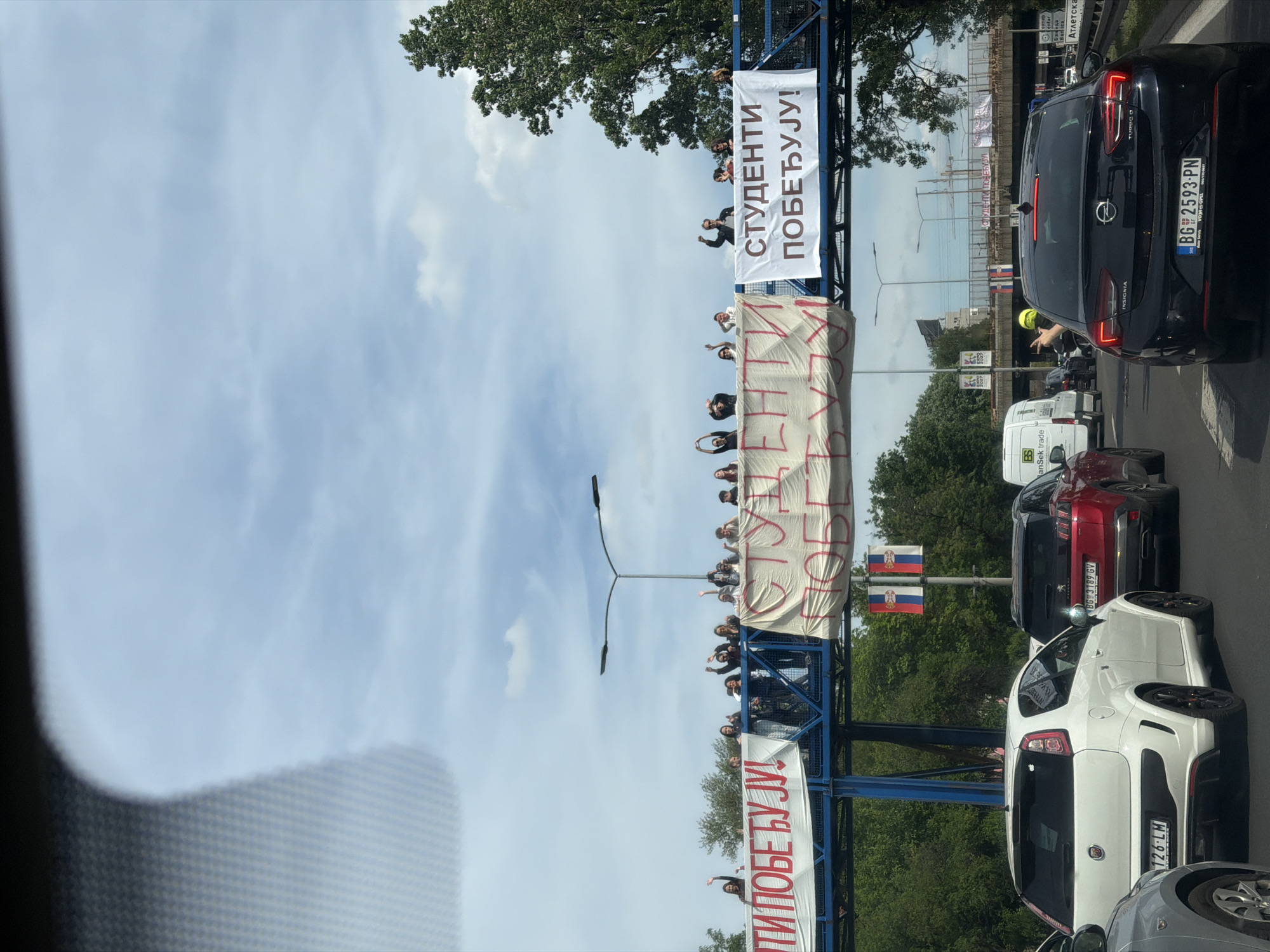 Student victory banners displayed over Belgrade traffic jam