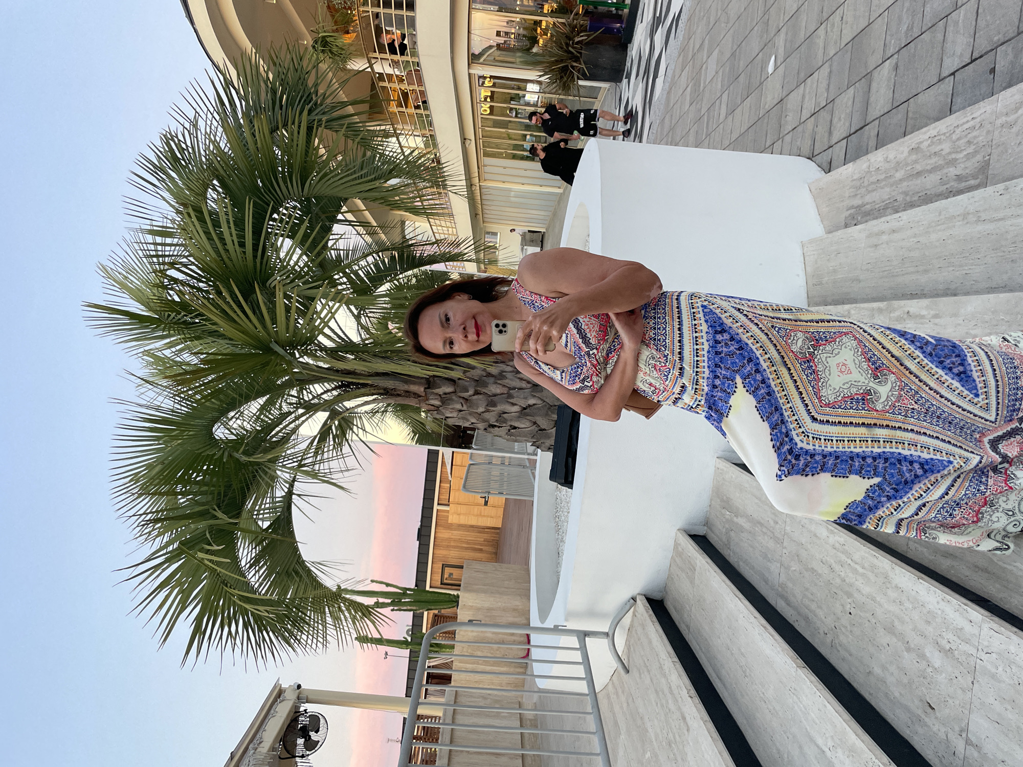 Selfie on outdoor stairs in Sochi, patterned dress