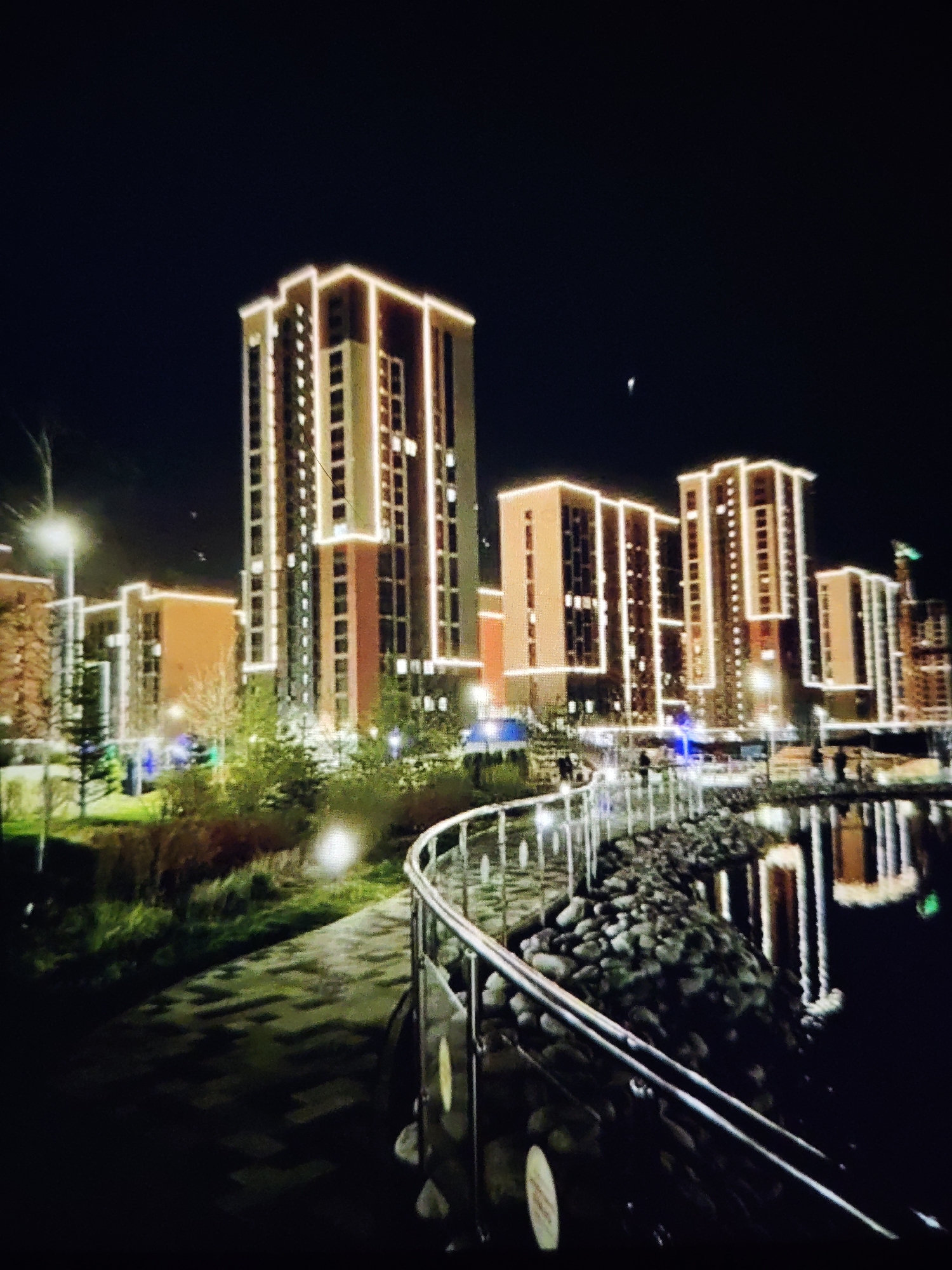Stavropol at night: lit fountains and residential towers