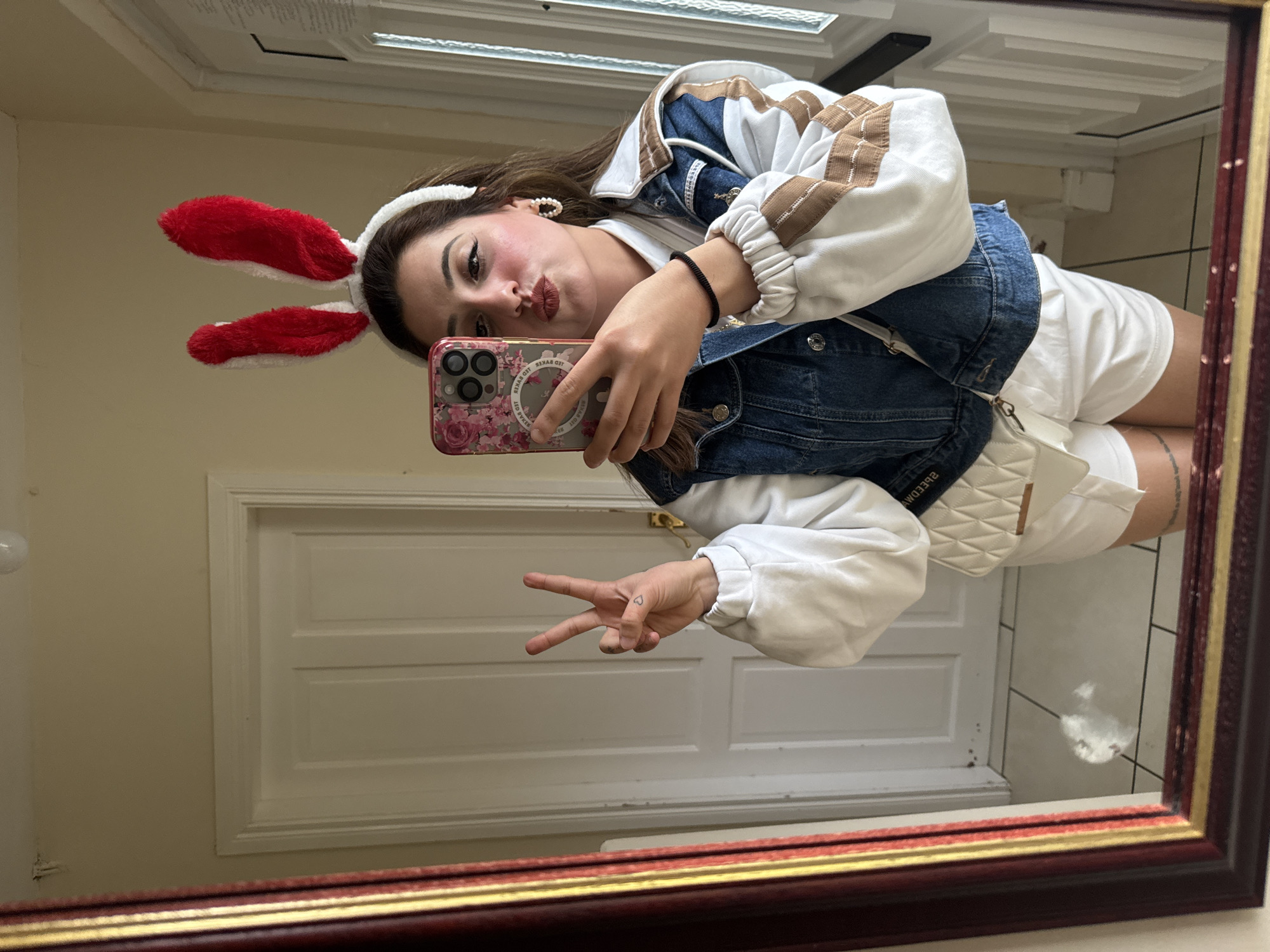 Person takes selfie with bunny ears in Armagh mirror