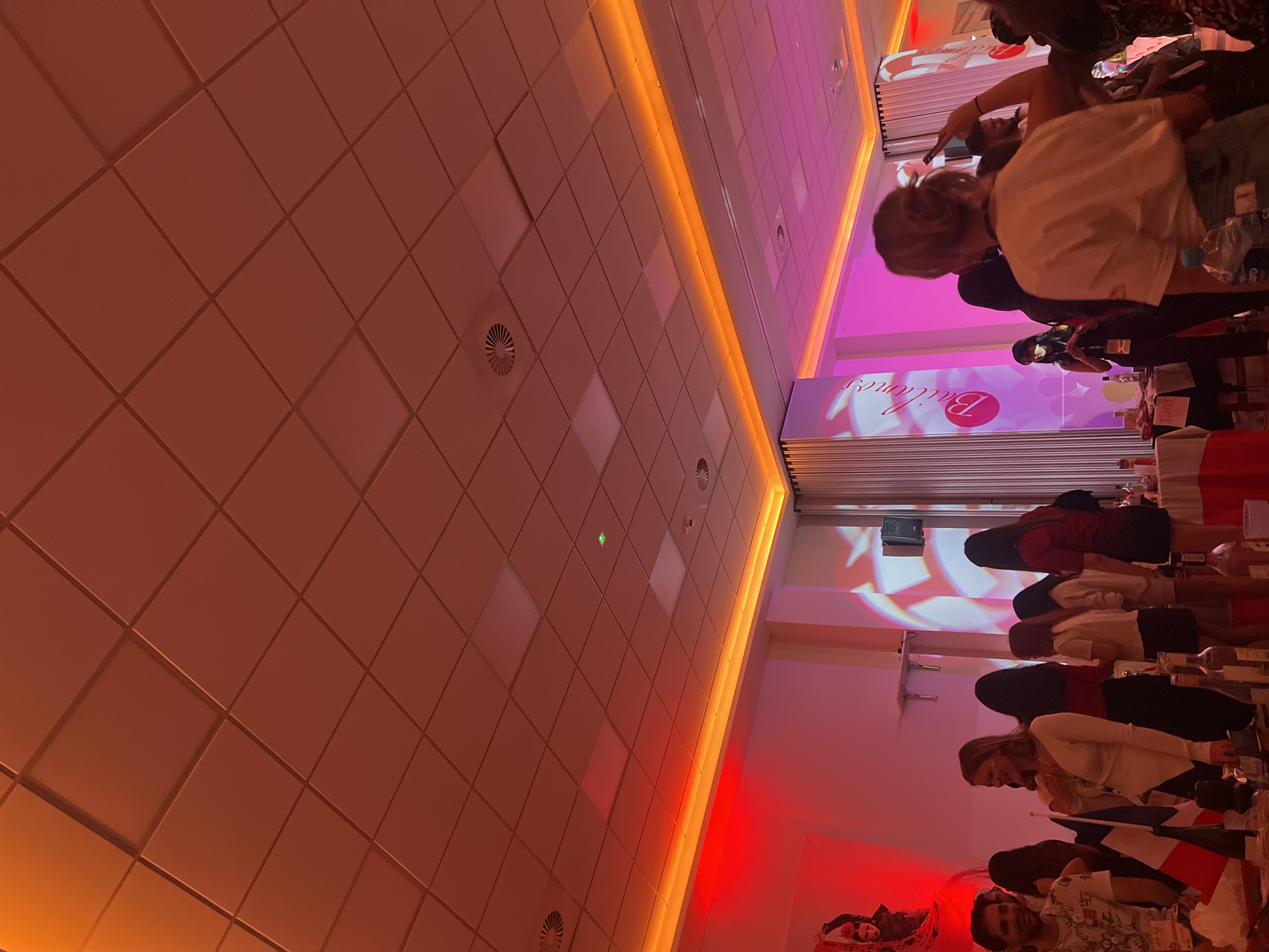 Indoor gathering documented in modern hall, Bydgoszcz, Poland