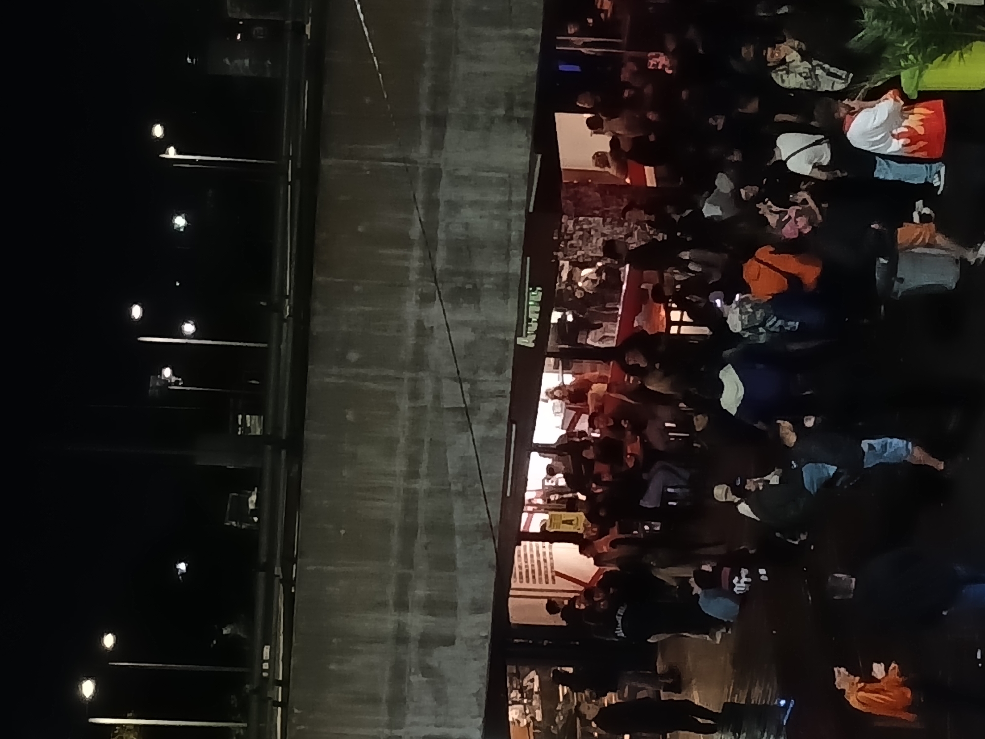 Late-night social gathering documented in Buenos Aires Puerto Madero district